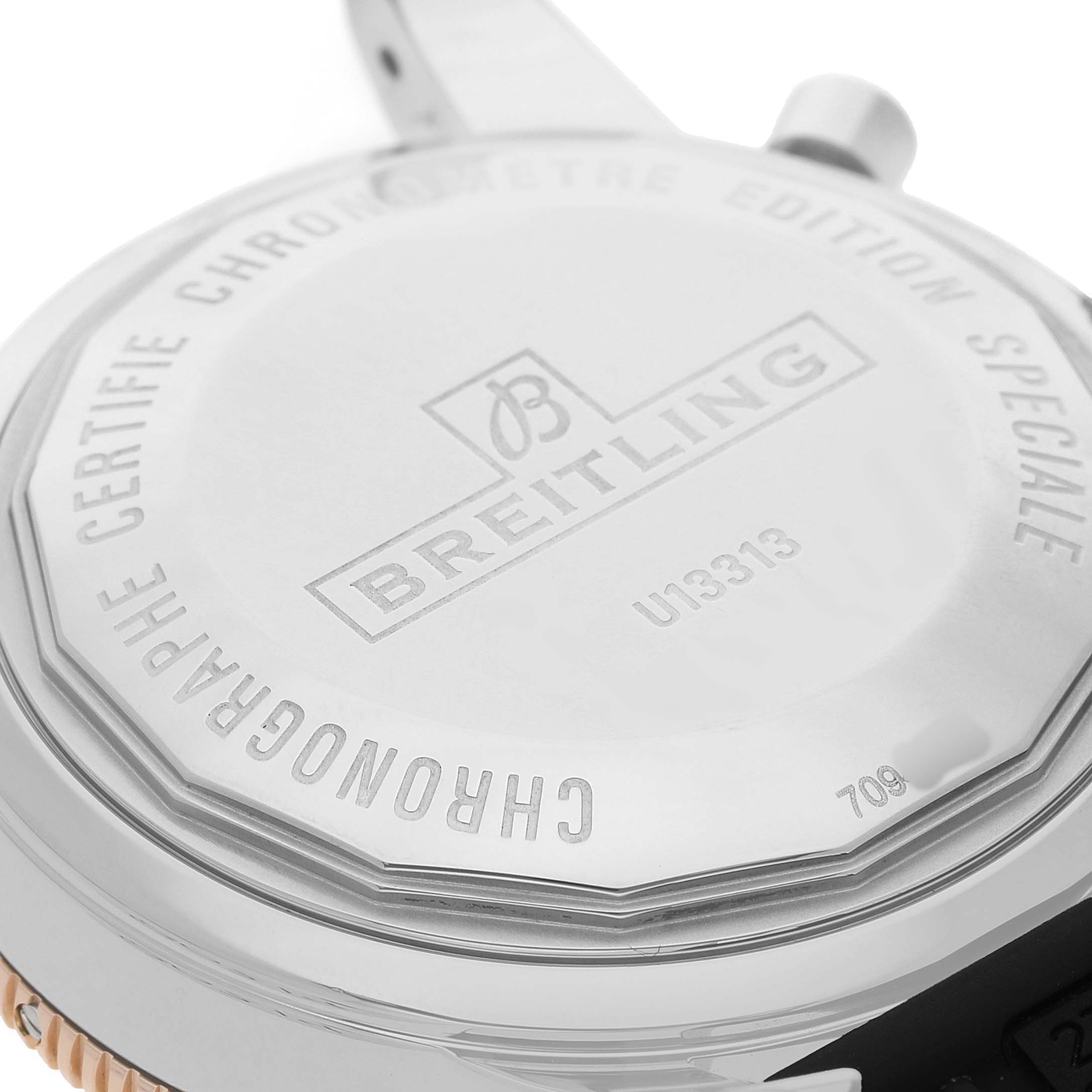 The image shows the back casing of the Breitling Superocean U13313 Men's Stainless Steel Black Dial, featuring branding and model information at an angle.