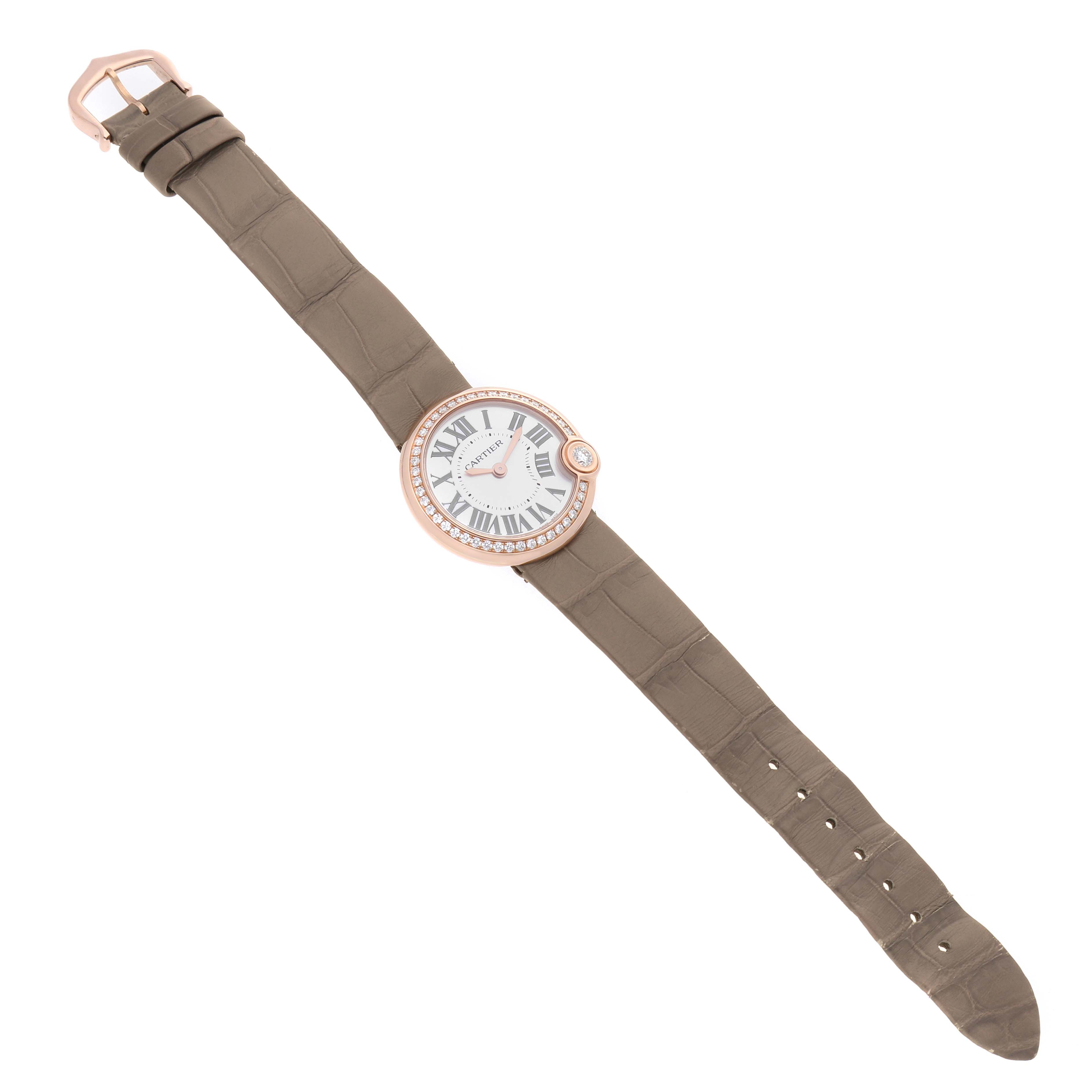The Cartier Ballon Blanc WJBL0012 Women's Rose Gold Silver Dial watch is shown from a top-down angle, displaying its full face, strap, and buckle.