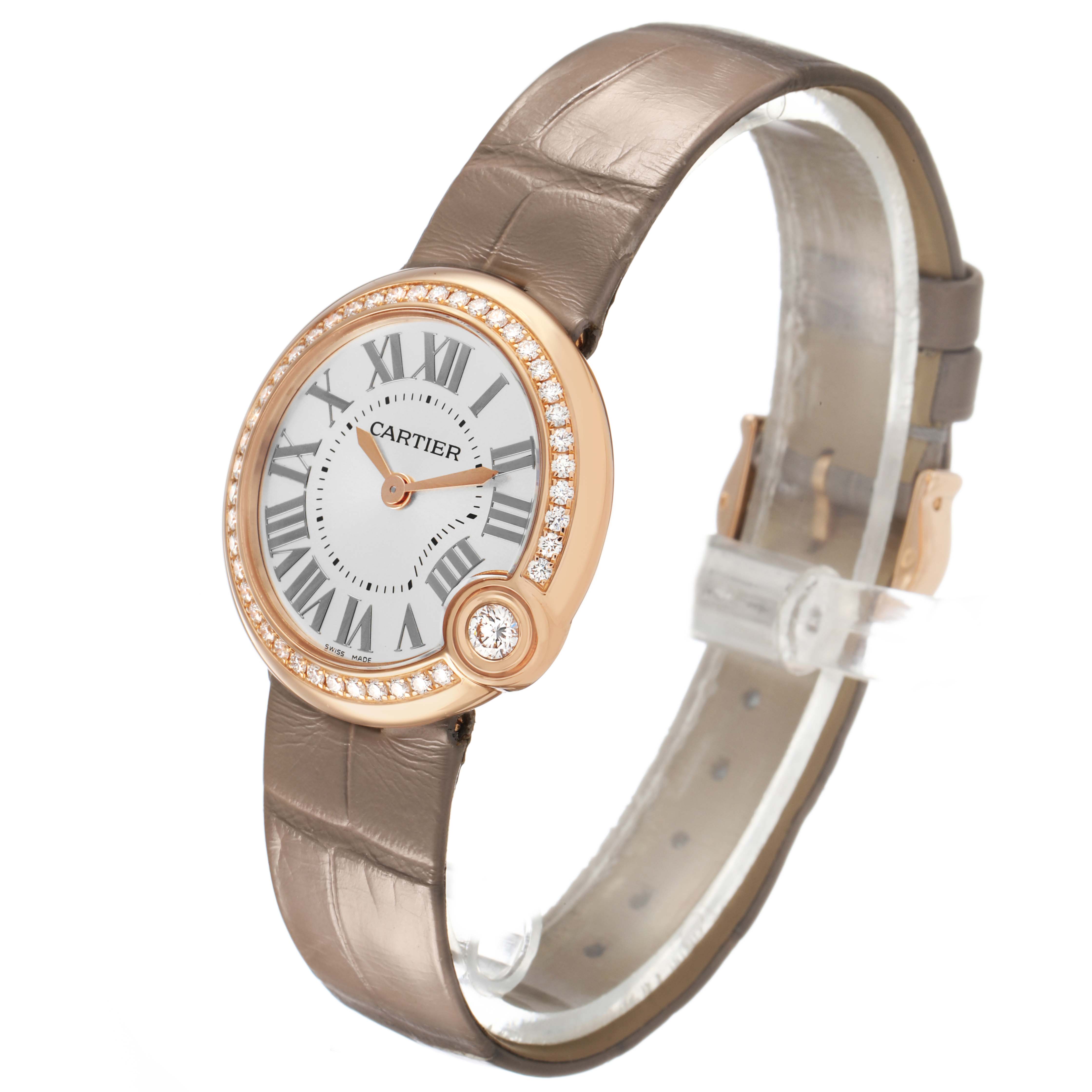 The Cartier Ballon Blanc WJBL0012 Women's Rose Gold Silver Dial watch is shown at a side angle, displaying the face, diamond bezel, and leather strap.