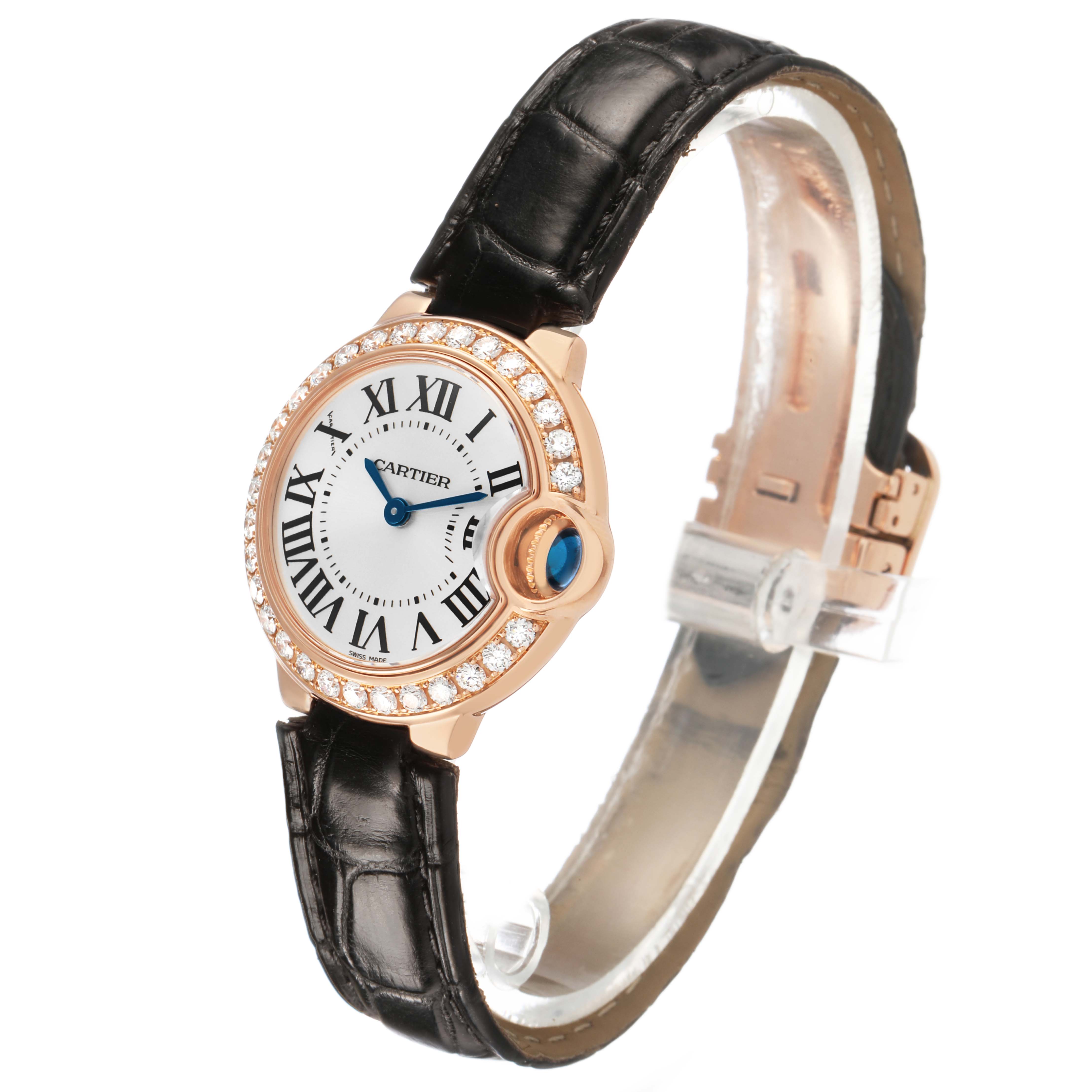 The Cartier Ballon Bleu WE900251 Women's Rose Gold Silver Dial watch is shown at a slight angle highlighting its face, Roman numerals, diamond bezel, and leather strap.