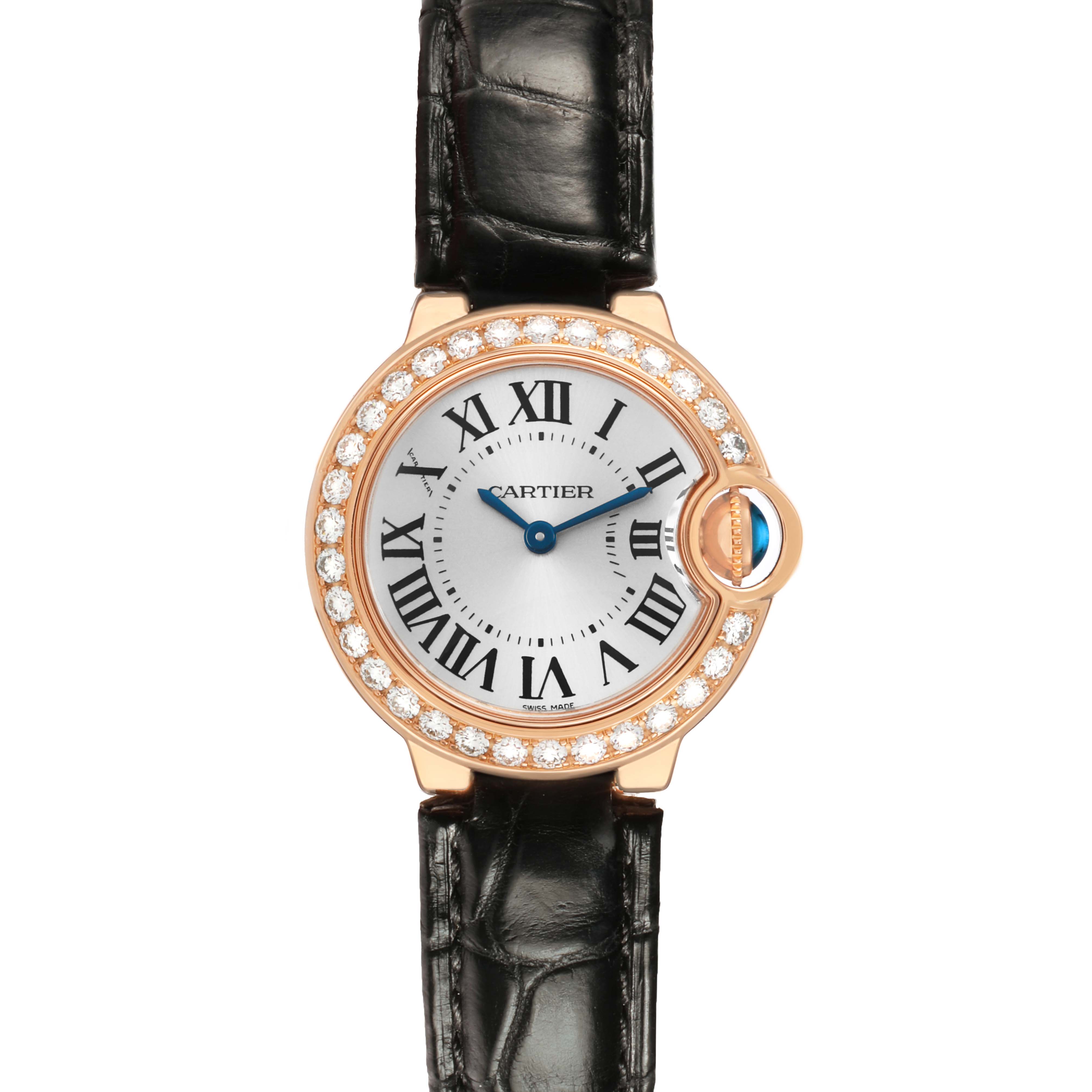 The Cartier Ballon Bleu WE900251 Women's Rose Gold Silver Dial watch is shown from a top view, highlighting its circular face, gemstone bezel, roman numerals, and leather strap.