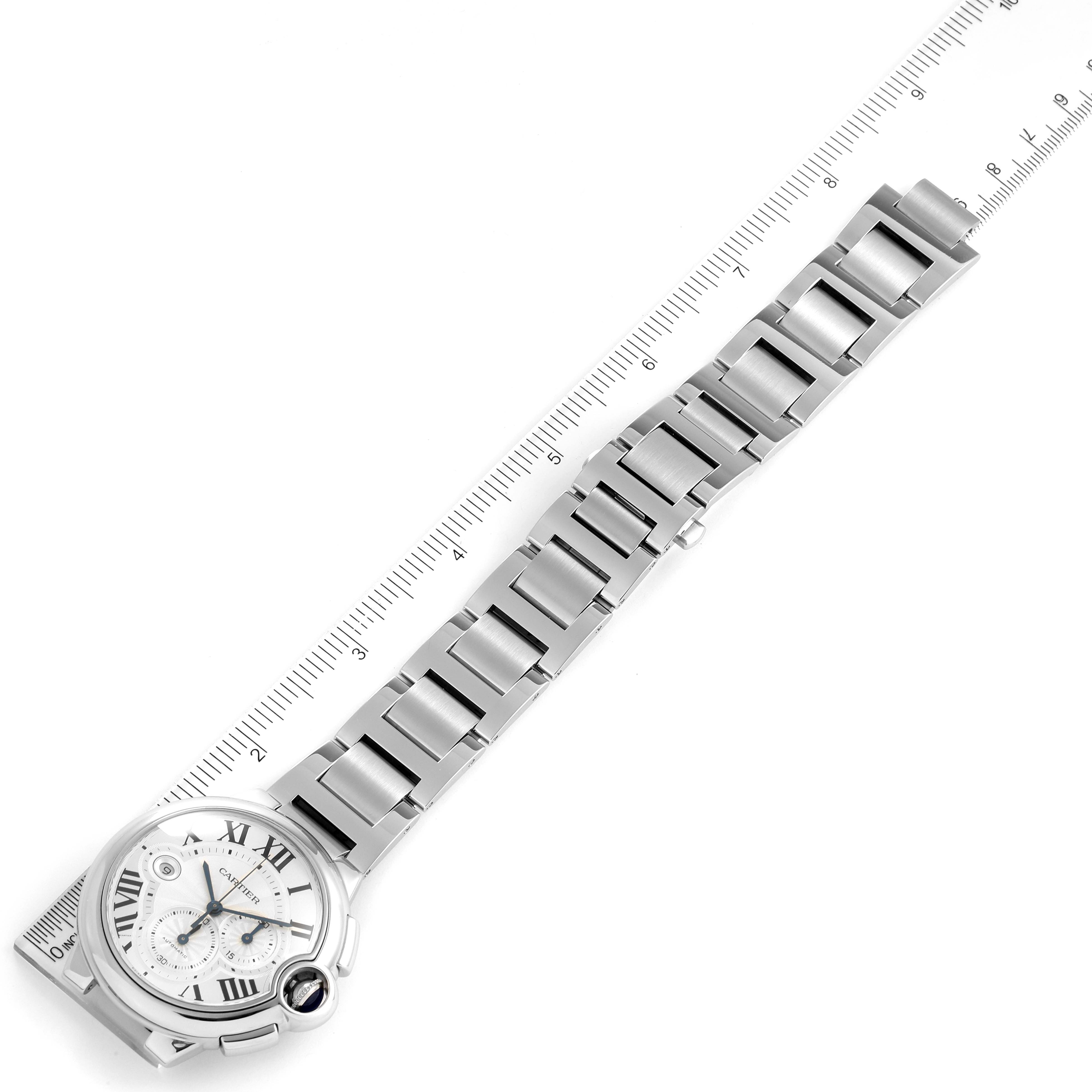 The image shows a Ballon Bleu by Cartier watch laid flat next to a ruler for measurement.