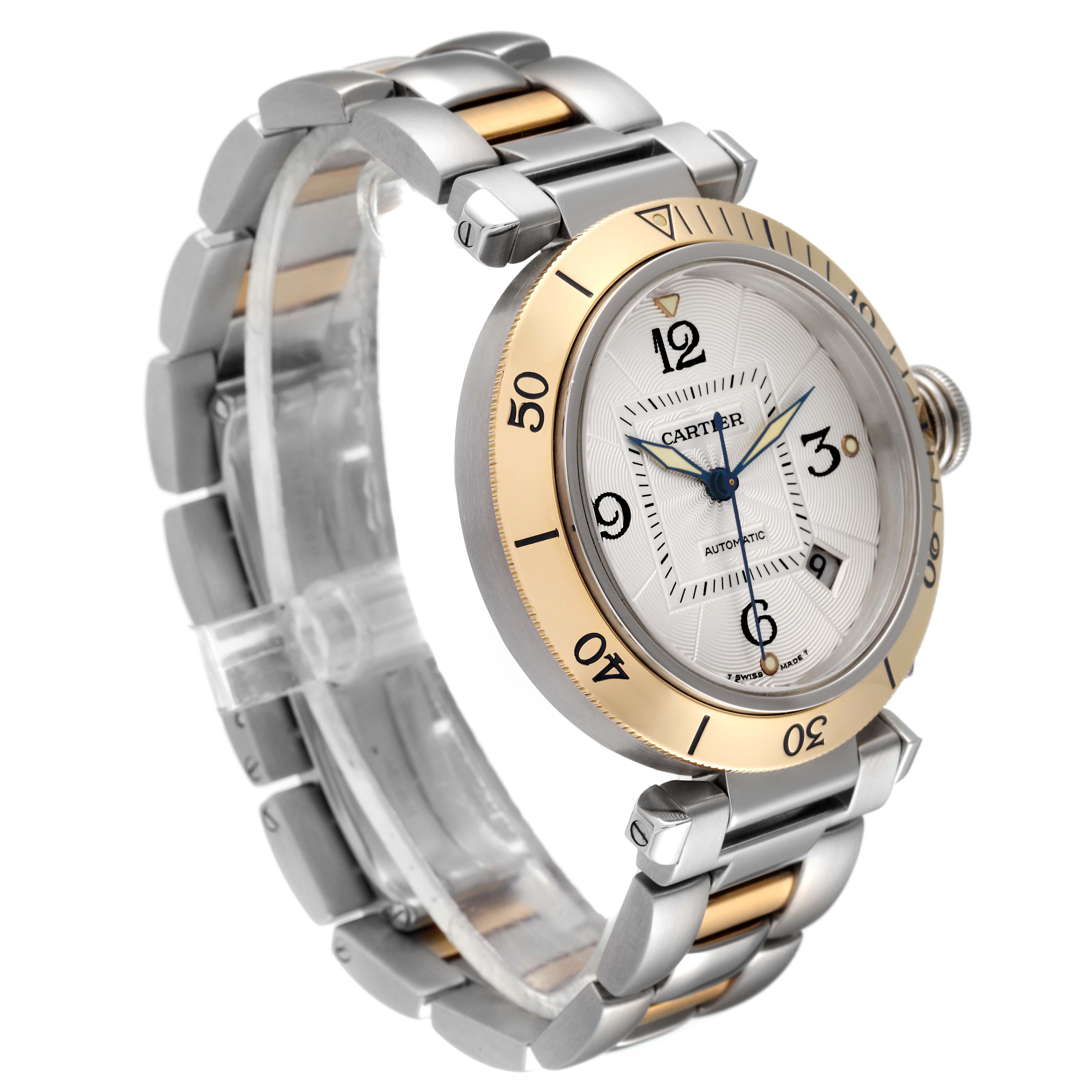 The image shows the Cartier Pasha W31035T6 Men's Steel and Gold (two tone) Silver Dial W31035T6 Men's Steel and Gold (two tone) Silver Dial watch at a three-quarter angle, highlighting its dial, bezel, and bracelet.