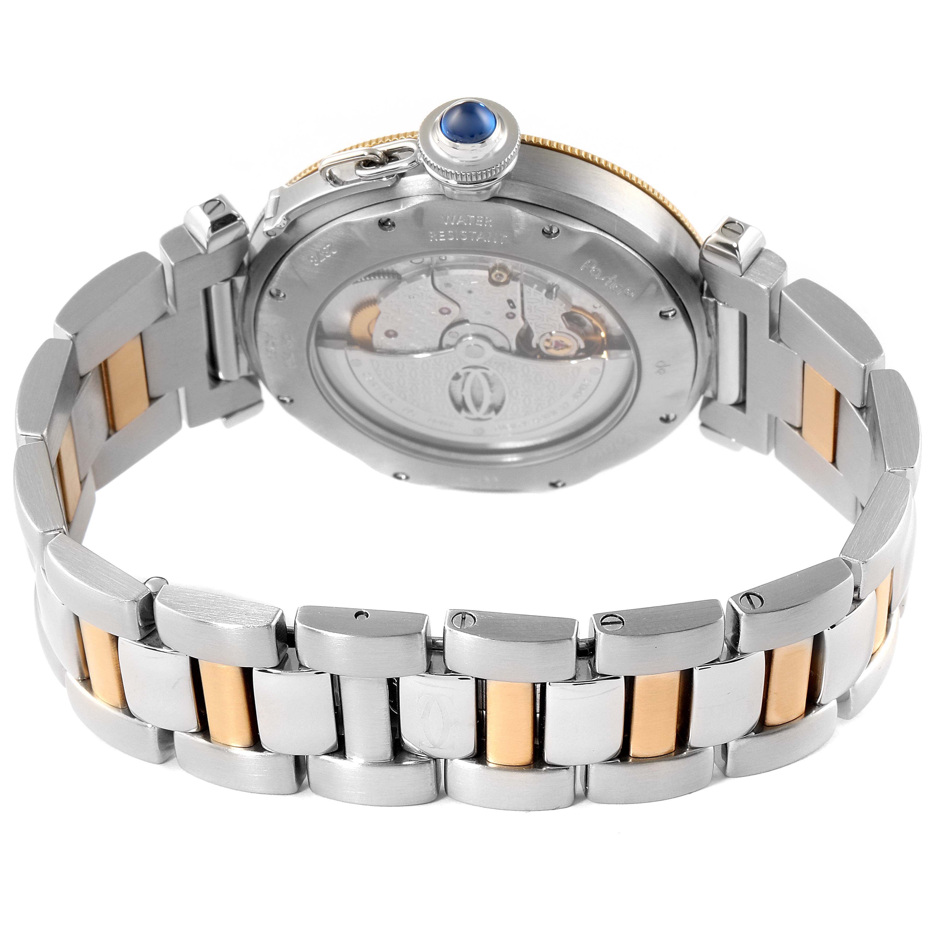 The image shows the back angle of a Cartier Pasha W31035T6 Men's Steel and Gold (two tone) Silver Dial W31035T6 Men's Steel and Gold (two tone) Silver Dial watch, highlighting its transparent case back and two-tone bracelet.
