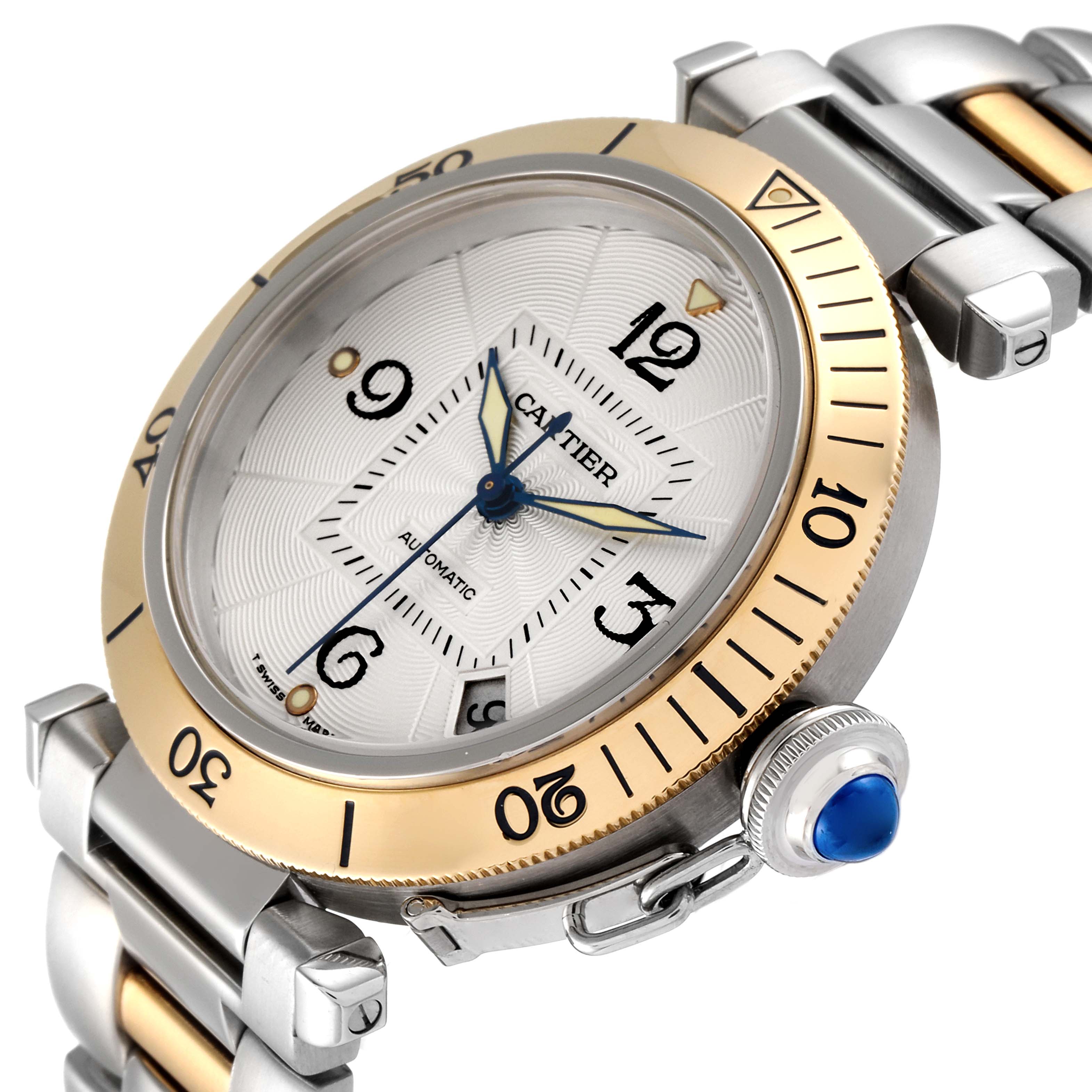 The image shows a front angle of the Cartier Pasha W31035T6 Men's Steel and Gold (two tone) Silver Dial W31035T6 Men's Steel and Gold (two tone) Silver Dial watch, highlighting its dial, bezel, crown, and part of the band.