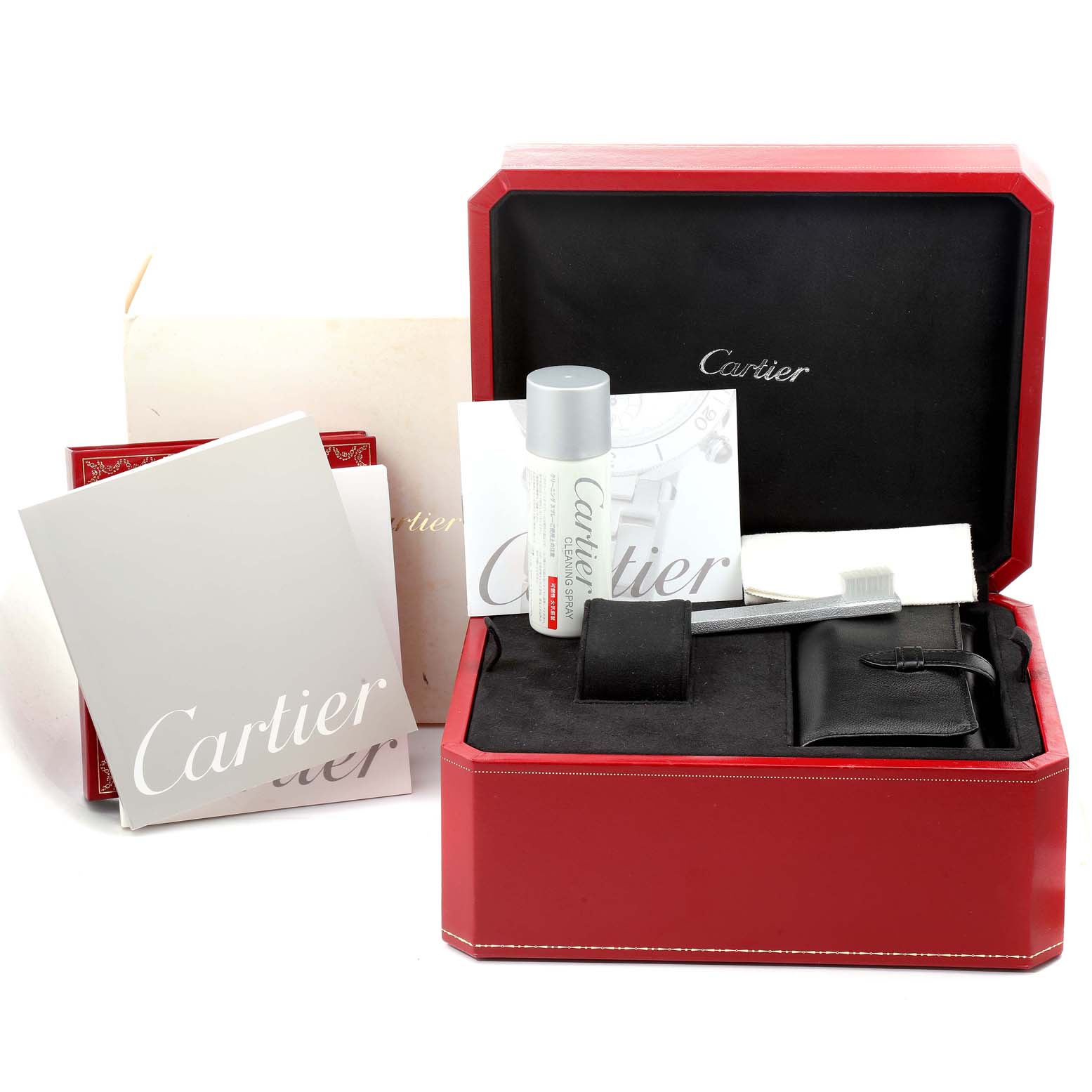 This image shows a Cartier Roadster W62000V3 Men
s Stainless Steel Silver Dial W62000V3 Men
s Stainless Steel Silver Dial watch box, manuals, cleaning tools, and a Cartier-branded cleaning solution.