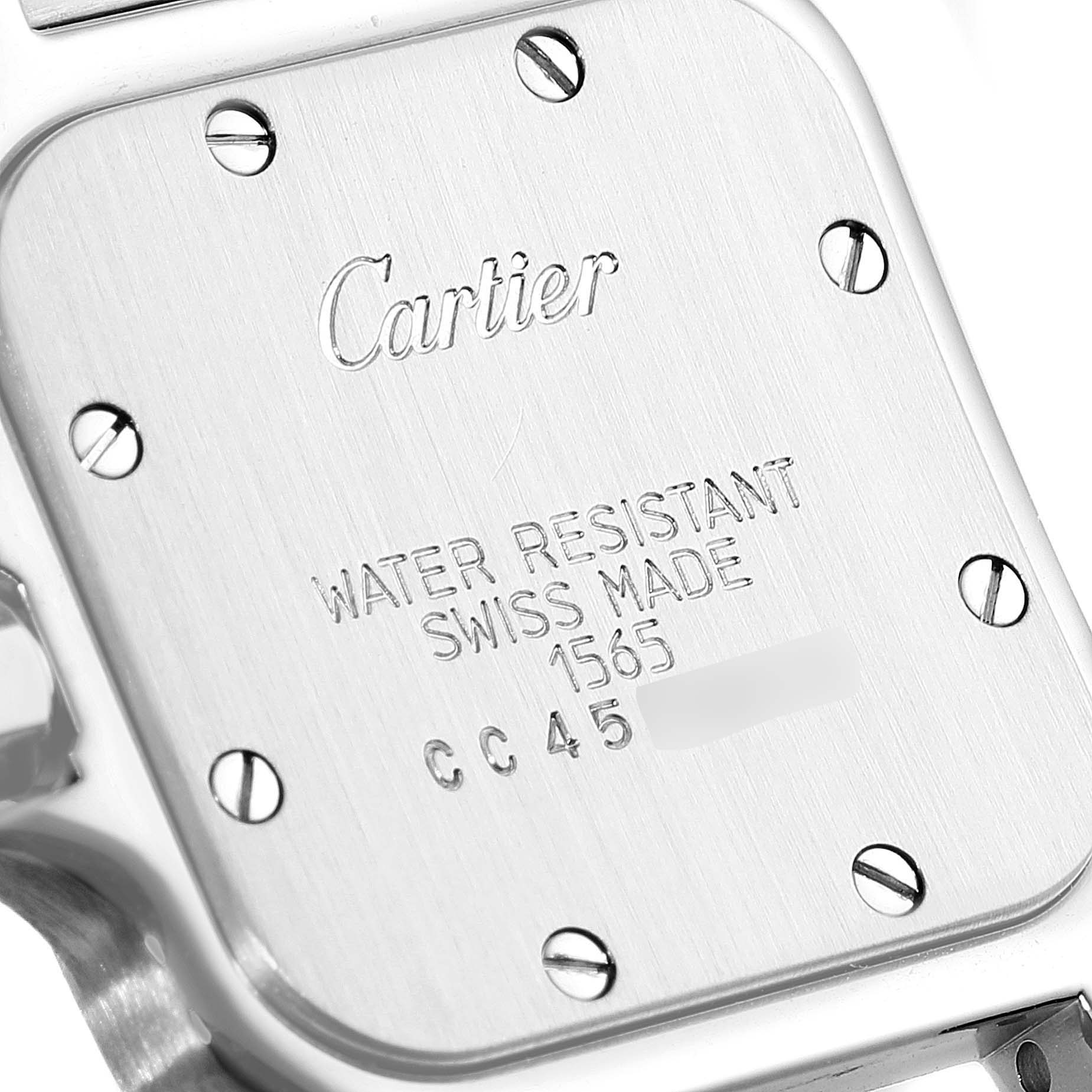 This image shows the back of a Cartier Santos 1565 Women's Stainless Steel Silver Dial 1565 Women's Stainless Steel Silver Dial watch, highlighting the engraved brand, model, and water resistance information.