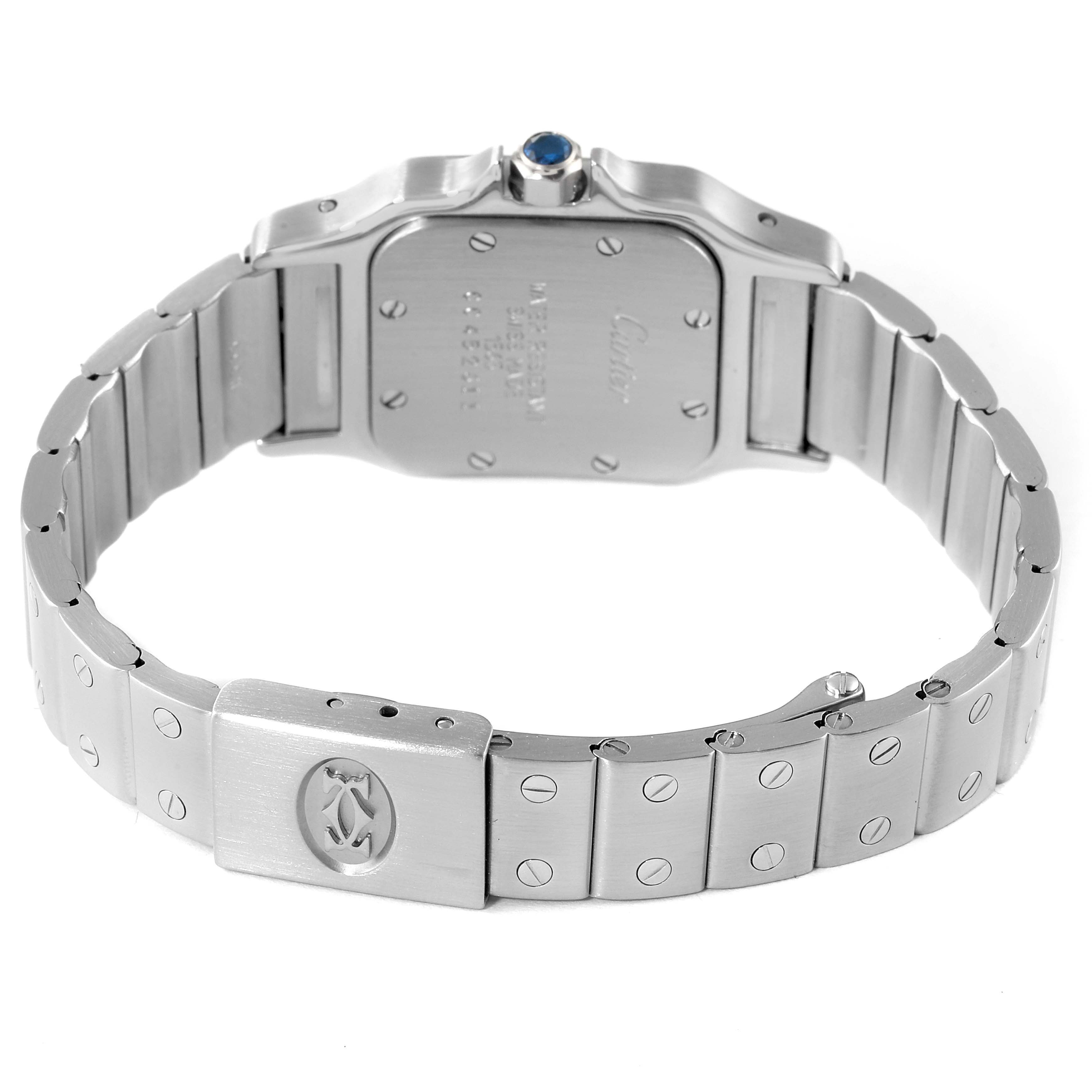 The image shows the back view of the Santos model by Cartier, highlighting its case back, bracelet, and clasp.