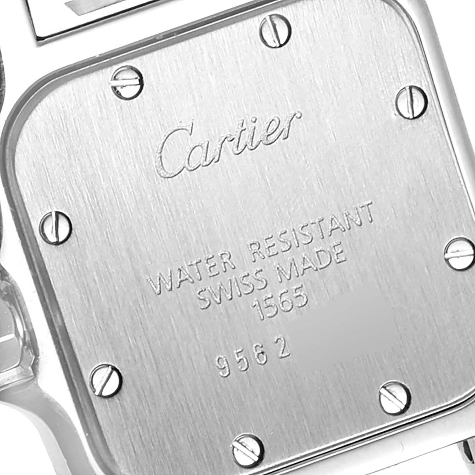 The image shows the rear case of a Cartier Santos W20056D6 Women's Stainless Steel Silver Dial W20056D6 Women's Stainless Steel Silver Dial watch, highlighting the engraved branding and specifications.