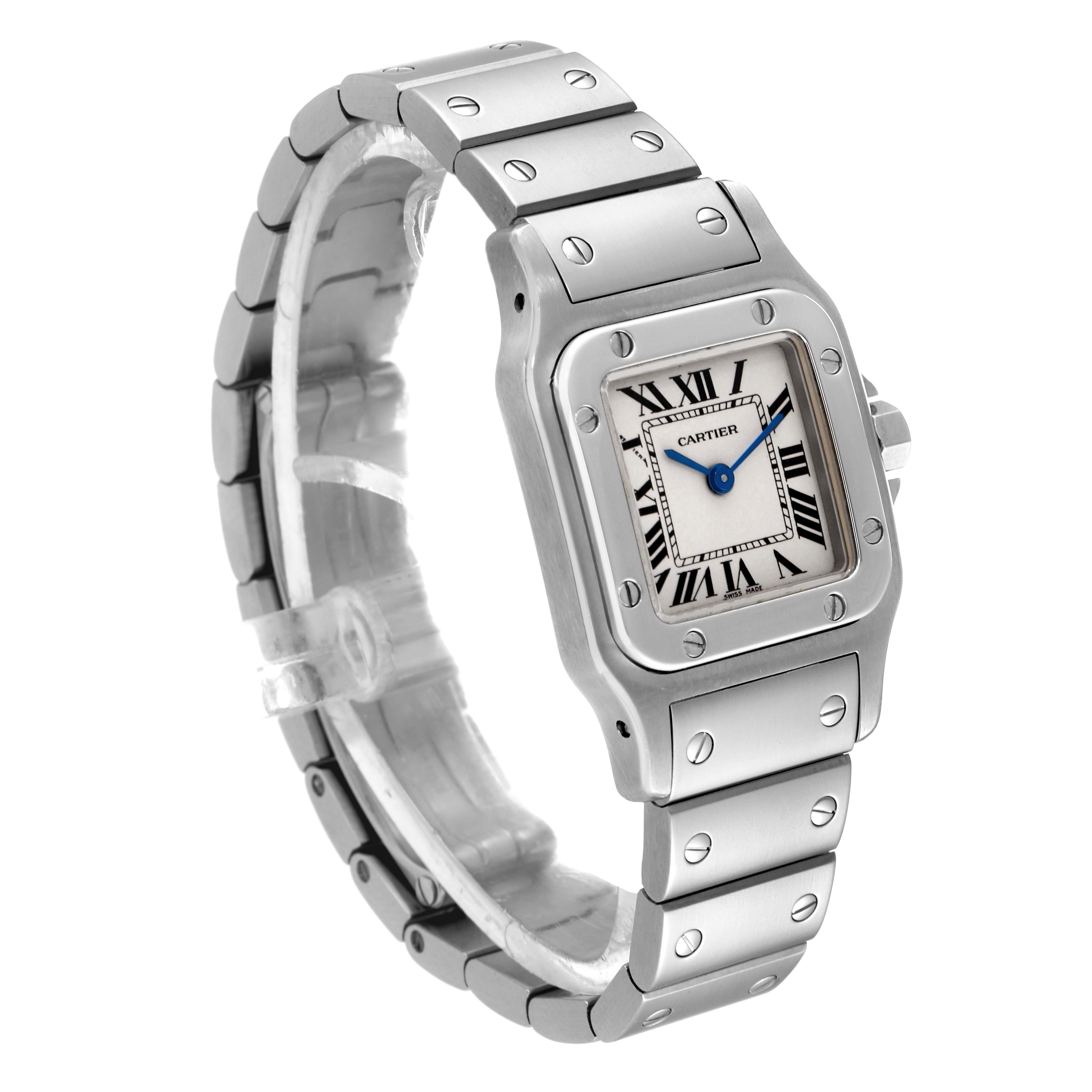 The Cartier Santos W20056D6 Women's Stainless Steel Silver Dial W20056D6 Women's Stainless Steel Silver Dial watch is shown at an angle displaying its face, bezel, and stainless steel bracelet.