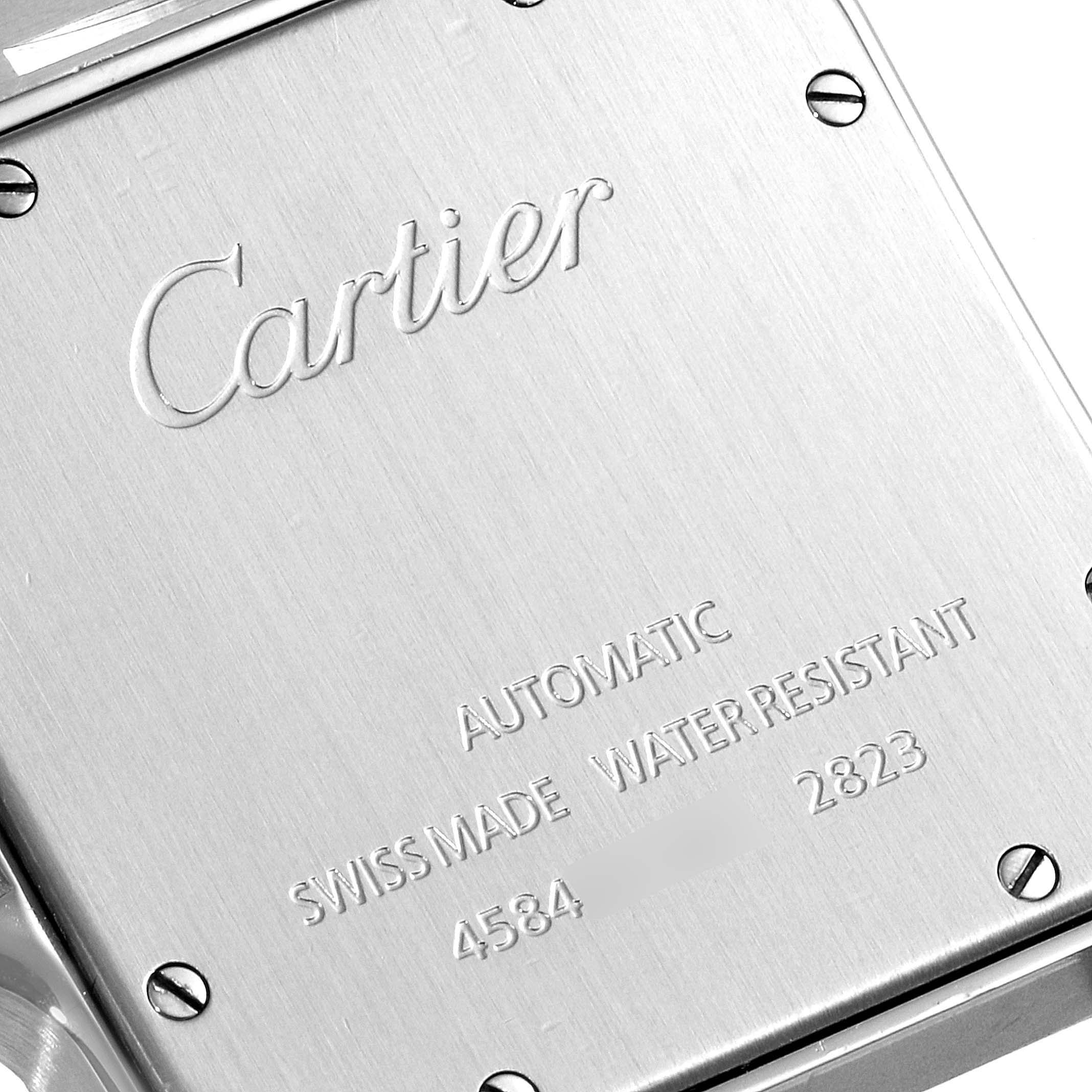 The image shows the back casing of a Cartier Santos W20099C4 Men's Steel and Gold (two tone) Silver Dial W20099C4 Men's Steel and Gold (two tone) Silver Dial watch, featuring branding, specifications, and serial numbers.