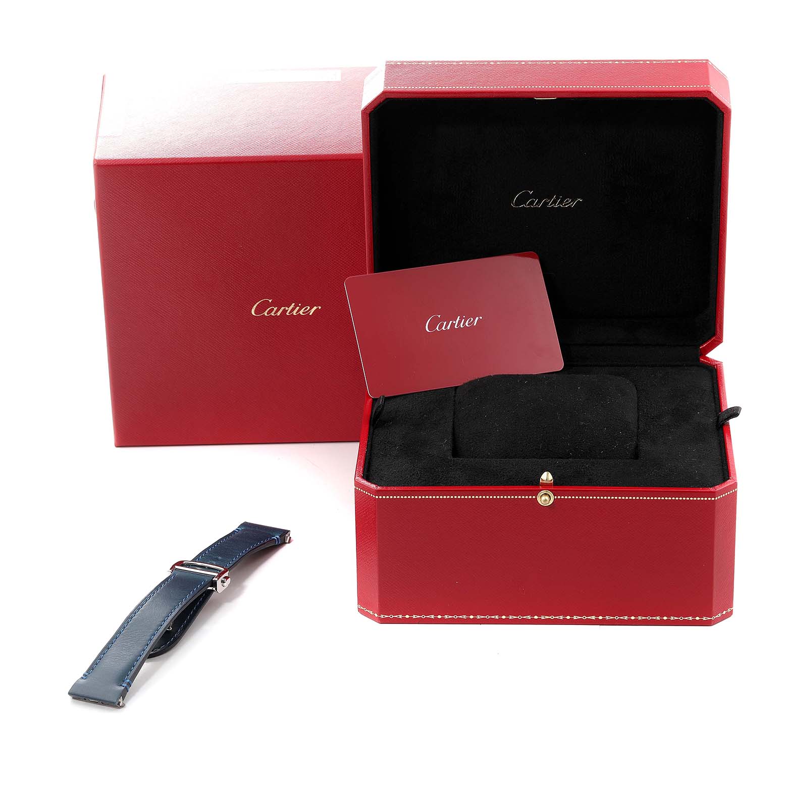 The image shows the red Cartier Santos WSSA0030 Men
s Stainless Steel Blue Dial WSSA0030 Men
s Stainless Steel Blue Dial watch box, a black interior, a warranty card, and a blue replacement strap.
