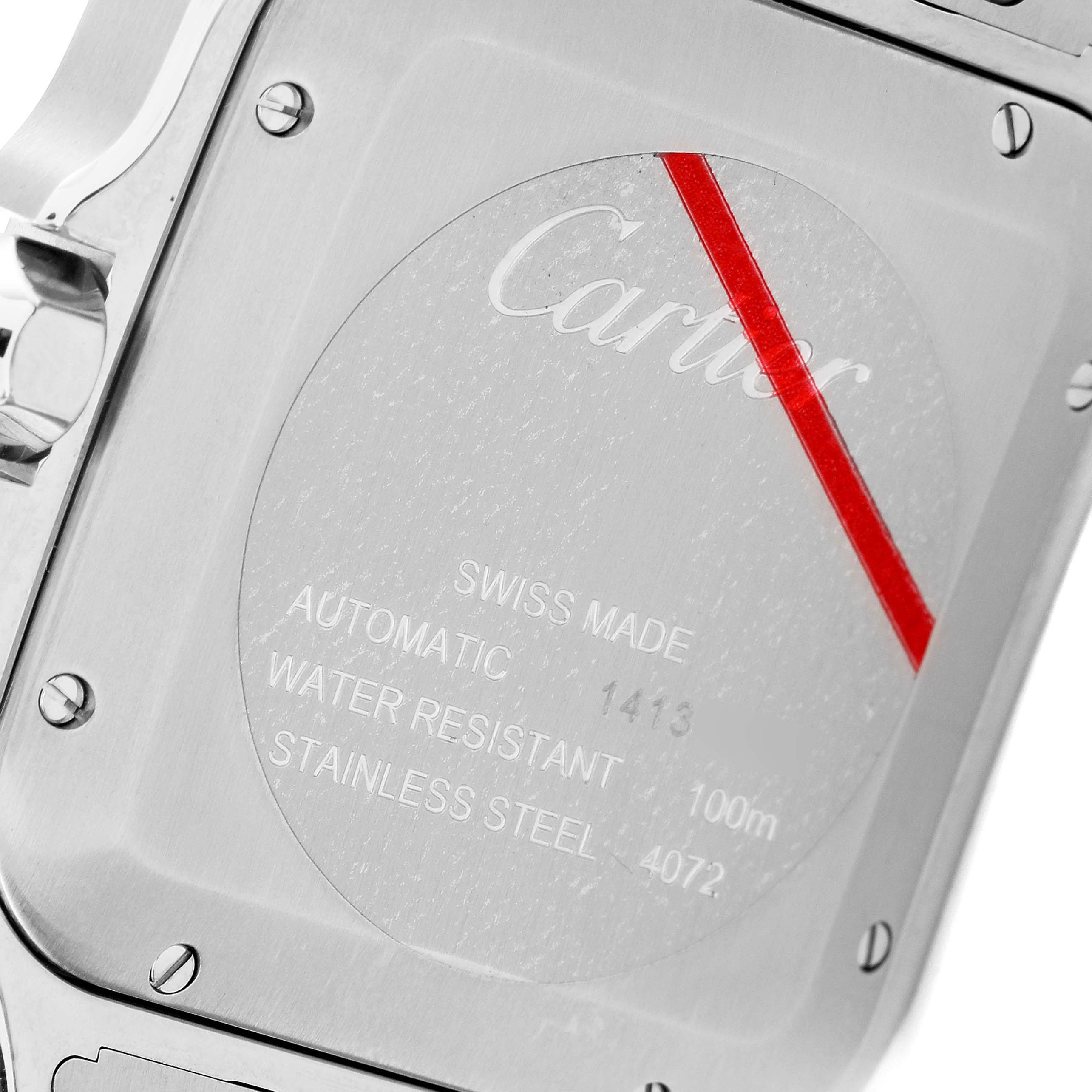 The image shows the back case of a Santos model watch by Cartier, highlighting its inscriptions and screws.