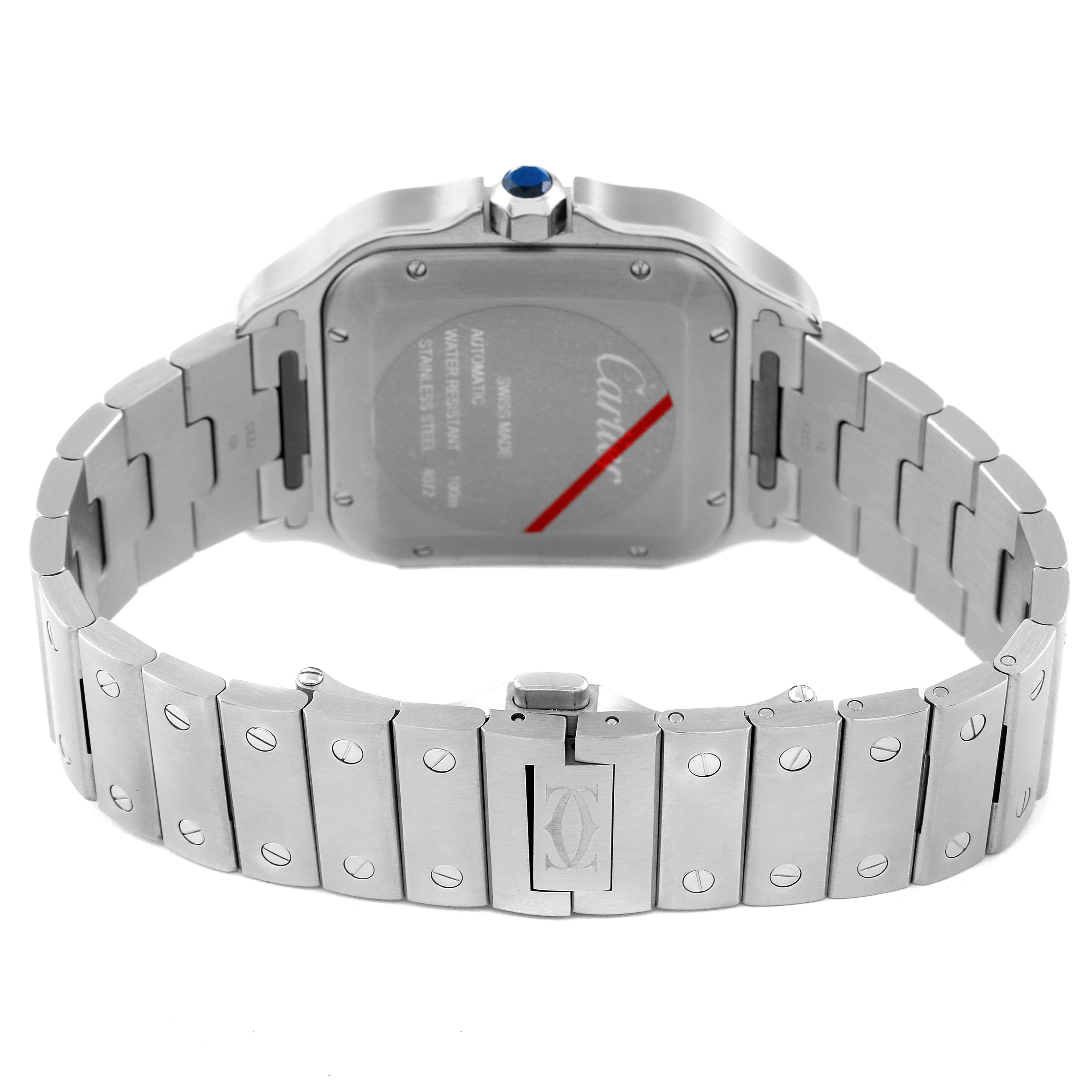 The Cartier Santos WSSA0030 Men
s Stainless Steel Blue Dial WSSA0030 Men
s Stainless Steel Blue Dial watch is shown from the back, highlighting the back case, bracelet, and clasp.