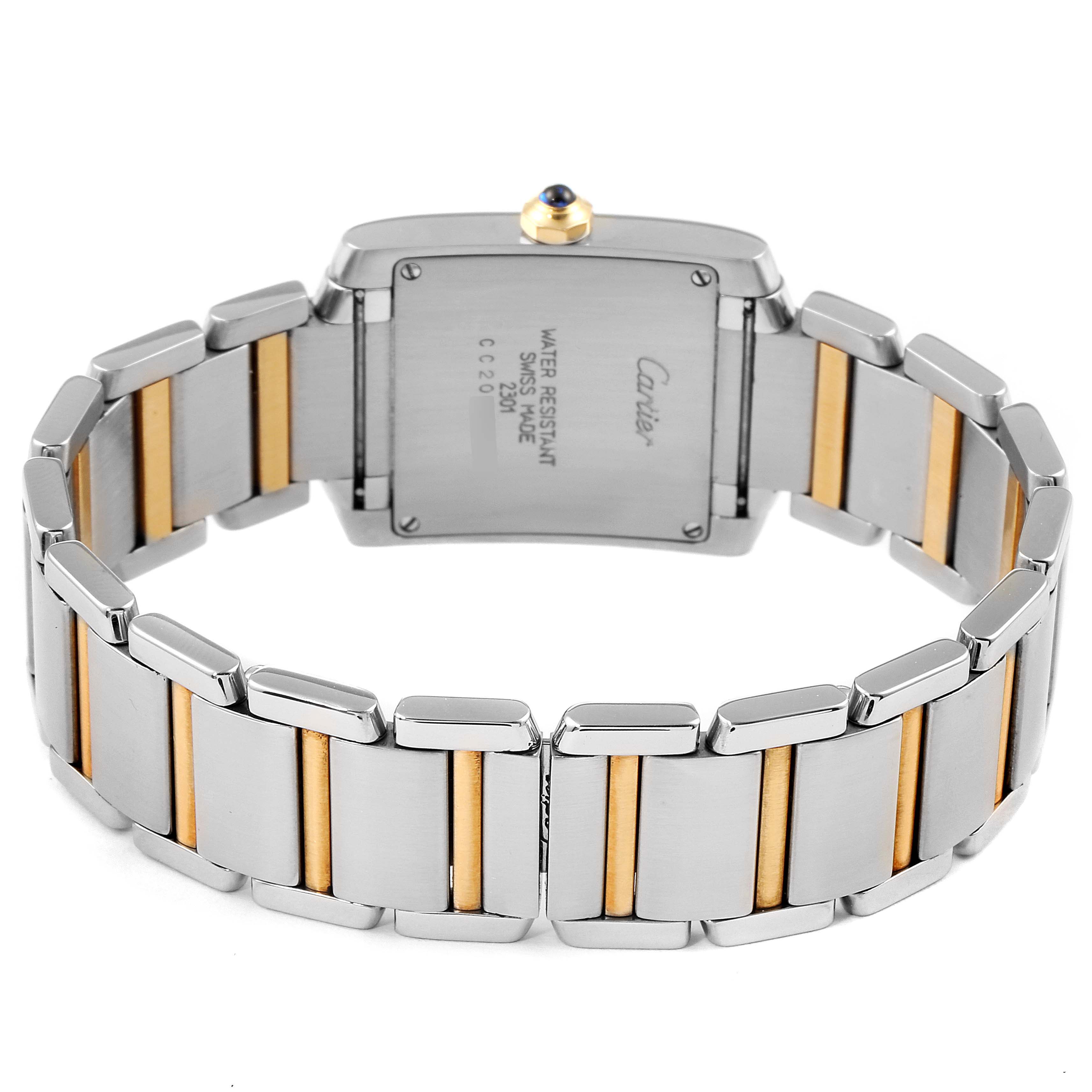 The image shows the back case and bracelet of a Cartier Tank Francaise W2TA0003 Women's Steel and Gold (two tone) Silver Dial W2TA0003 Women's Steel and Gold (two tone) Silver Dial watch, highlighting its dual-tone links.