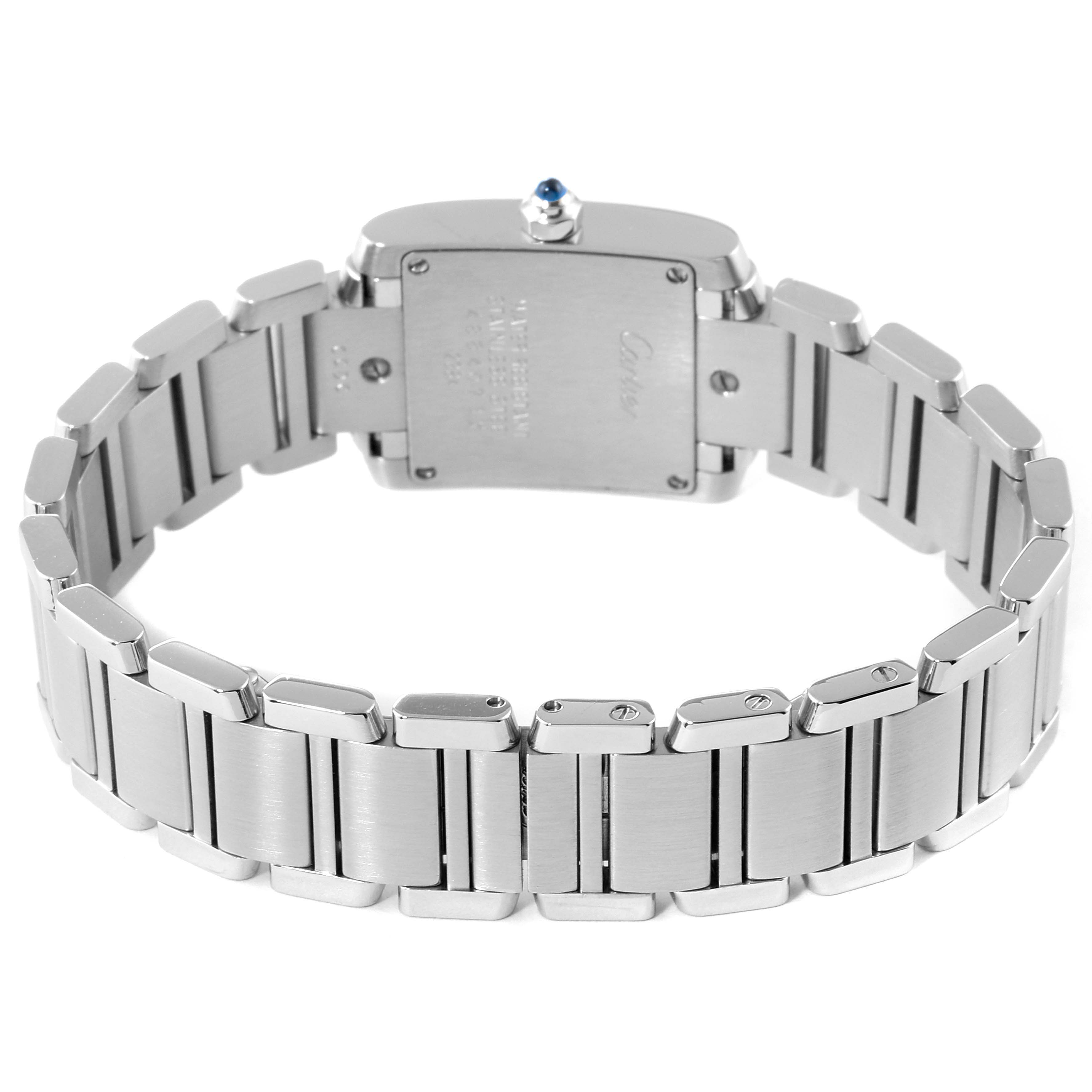 The image shows the back of a Tank Francaise watch by Cartier, highlighting the stainless steel bracelet and case back.