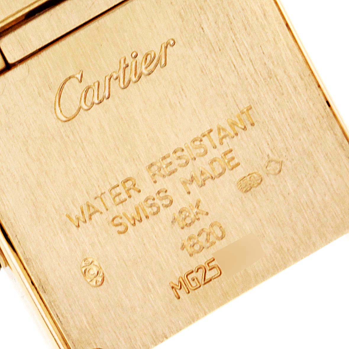 This image shows the engraved back casing of a Cartier Tank Française watch, highlighting the brand, water resistance, and material information.