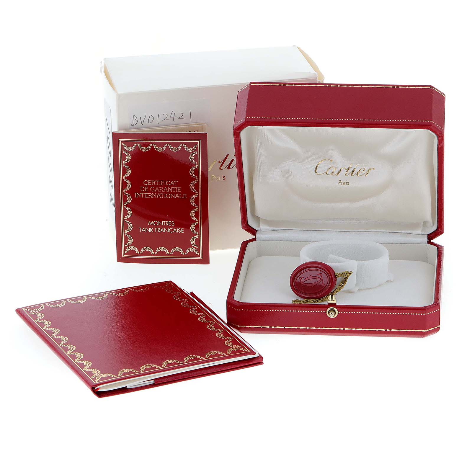 The image shows the packaging, guarantee booklet, and box for a Cartier Tank Francaise W50002N2 Women
s Yellow Gold Silver Dial W50002N2 Women
s Yellow Gold Silver Dial watch.