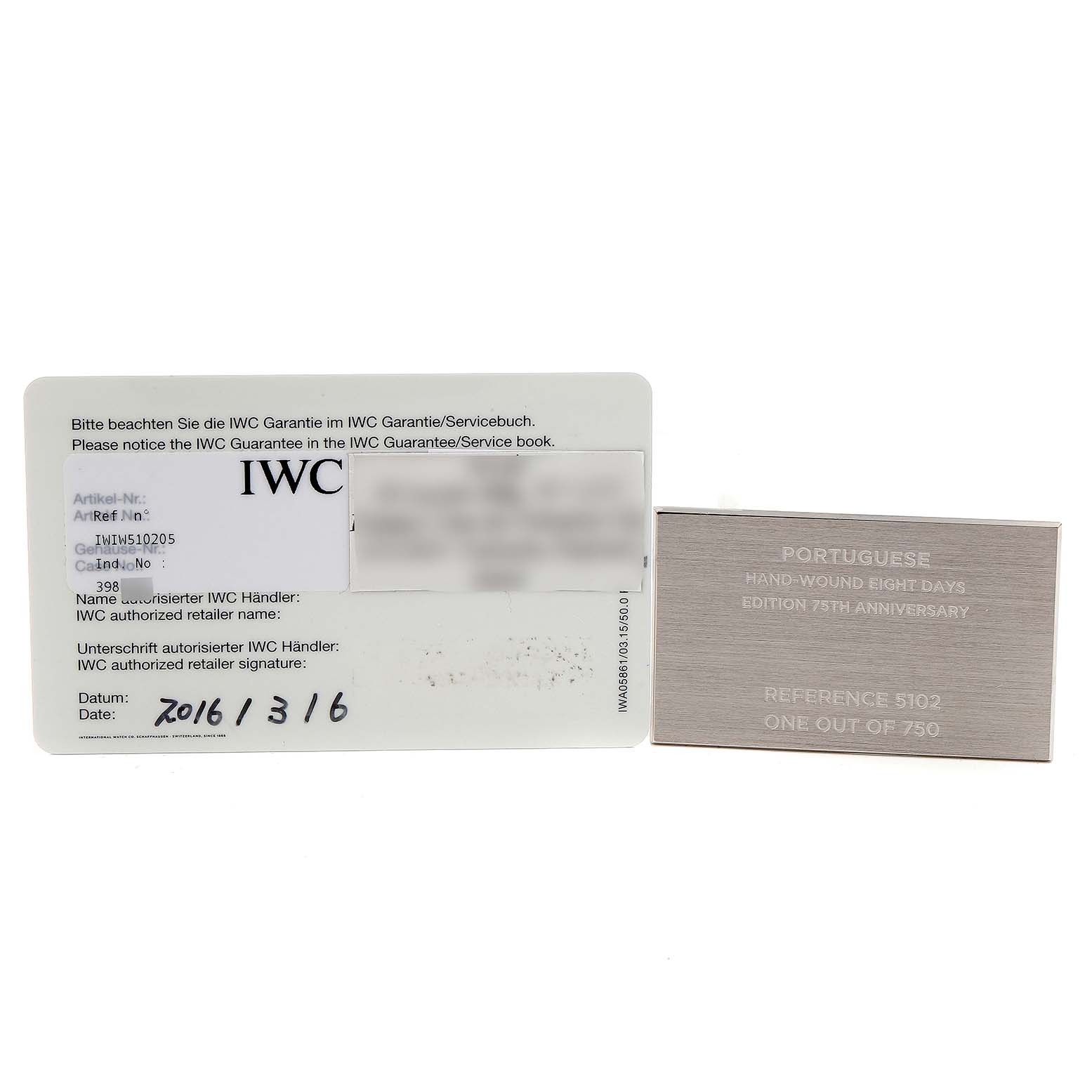 The image shows an IWC Guarantee card and a certificate plate for the IWC Portuguese IW510205 Men's Stainless Steel Black Dial IW510205 Men's Stainless Steel Black Dial Hand-Wound Eight Days Edition 75th Anniversary, Reference 5102.