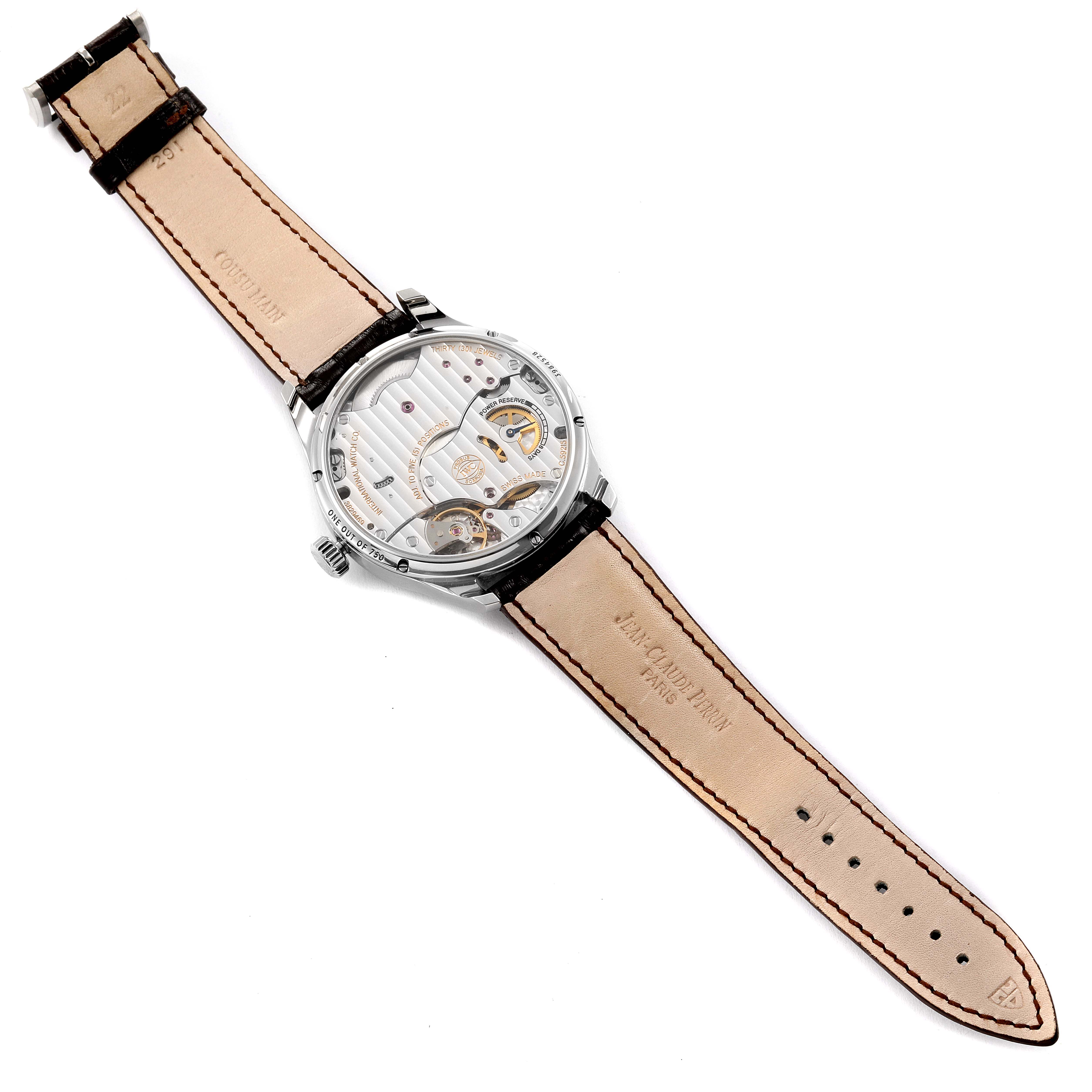 The image shows the back view of an IWC Portuguese IW510205 Men's Stainless Steel Black Dial IW510205 Men's Stainless Steel Black Dial watch, displaying its intricate movement and leather strap.