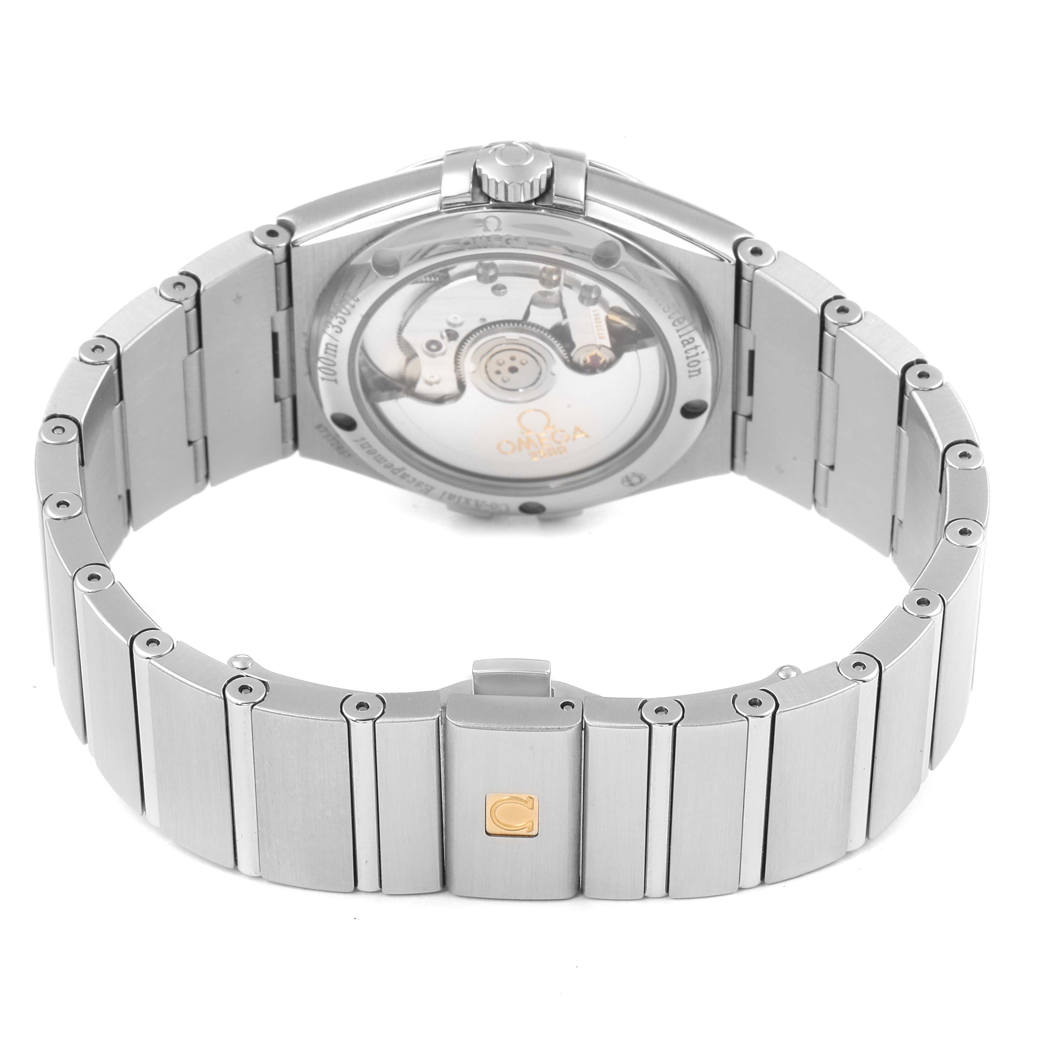 The image shows the back and bracelet of an Omega Constellation 123.10.35.20.02.002  Men
s Stainless Steel Silver Dial 123.10.35.20.02.002  Men
s Stainless Steel Silver Dial watch, highlighting the transparent case back and clasp.