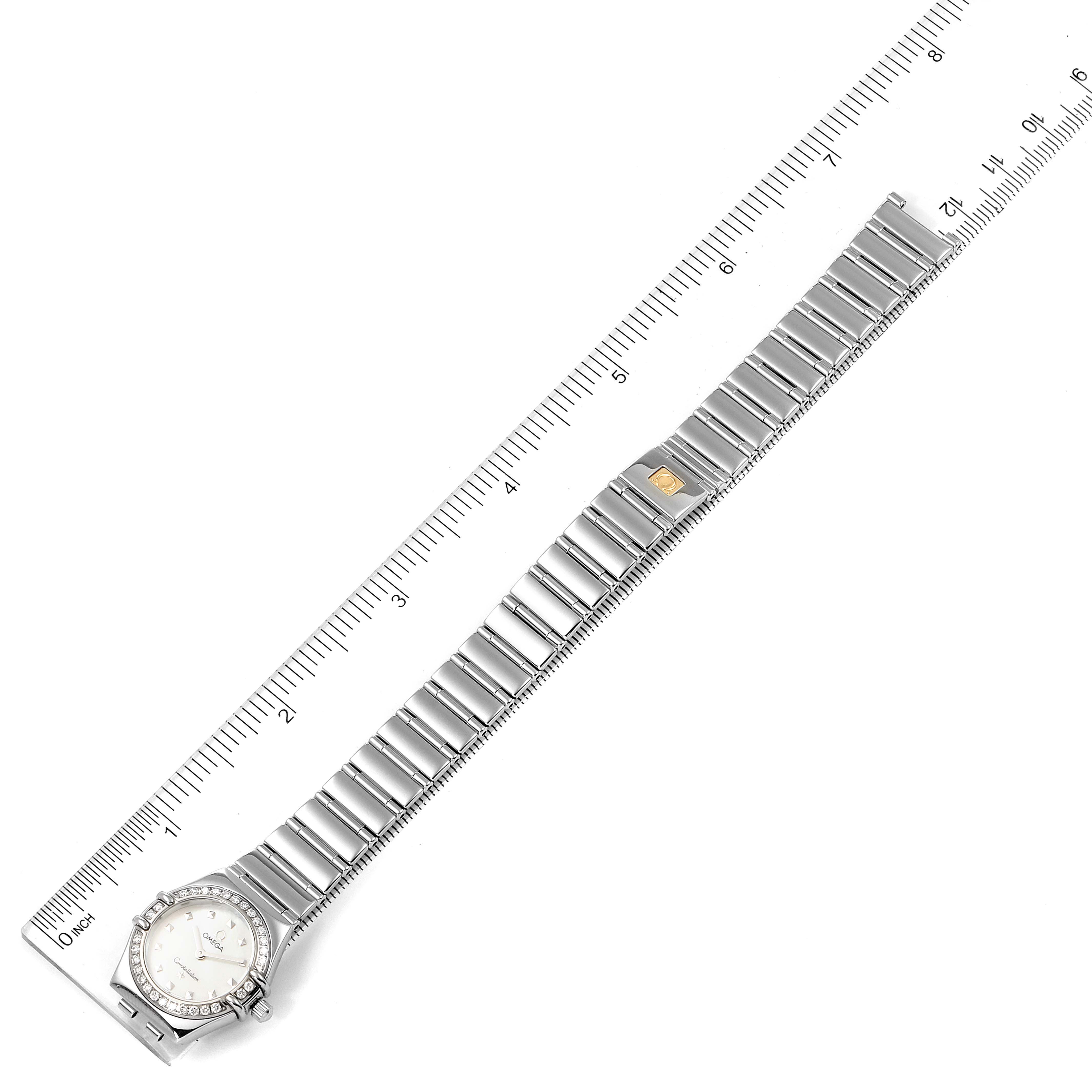 The image shows an overhead view of an Omega 1465.71.00 Women
s Stainless Steel Mother of Pearl Dial 1465.71.00 Women
s Stainless Steel Mother of Pearl Dial Constellation My Choice Mini Diamond Steel Ladies Watch 1465.71.00 model, including the band and face.