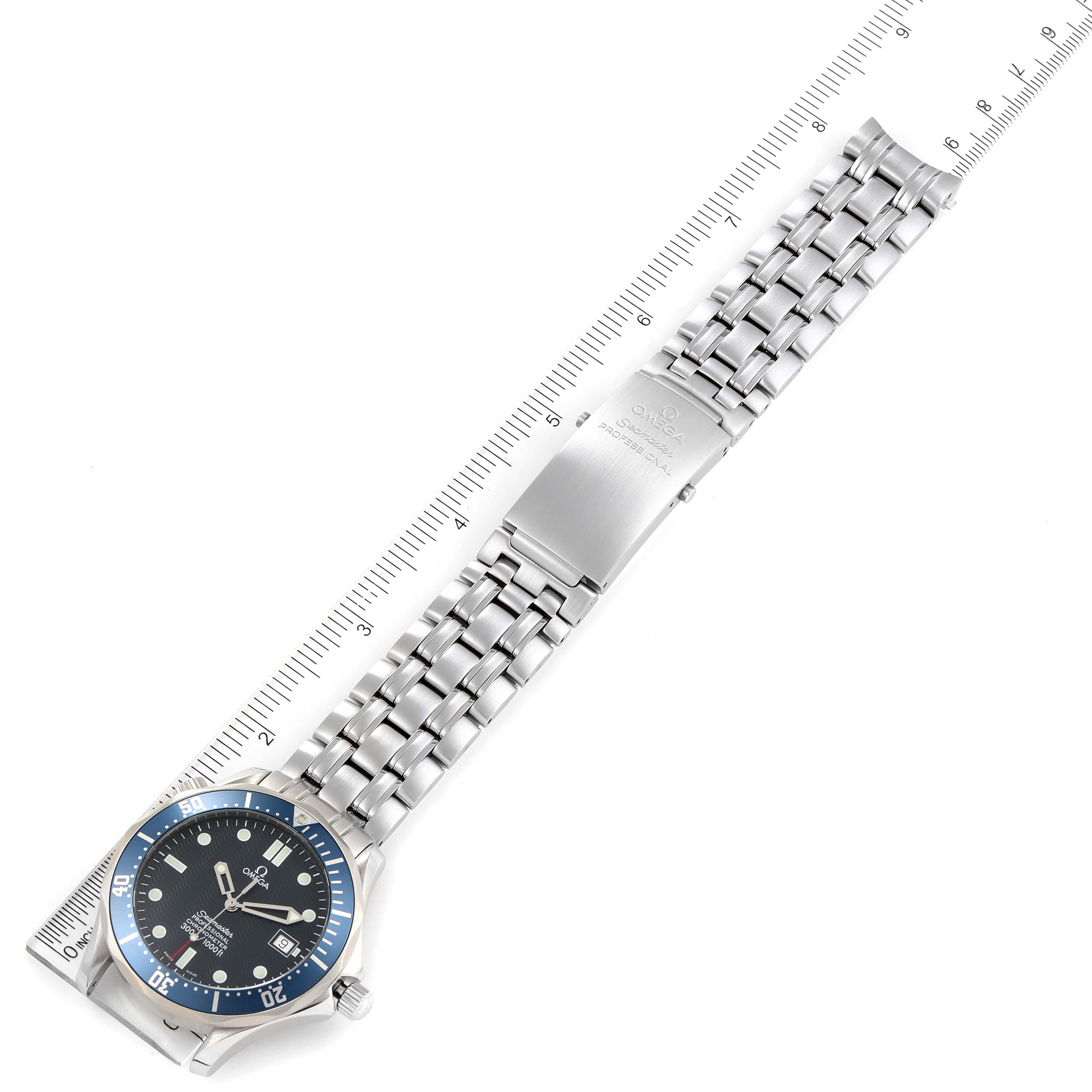 The image shows an Omega Seamaster 2531.80.00 Men's Stainless Steel Blue Dial 2531.80.00 Men's Stainless Steel Blue Dial watch with a stainless steel bracelet, positioned alongside a ruler for scale.