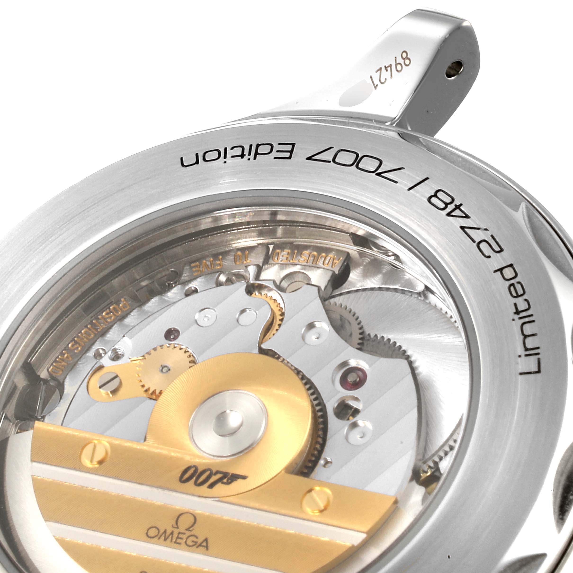 The image shows a close-up of the movement and case back of an Omega Seamaster 212.32.41.20.04.001 Men
s Stainless Steel White Dial 212.32.41.20.04.001 Men
s Stainless Steel White Dial 007 Limited Edition watch.