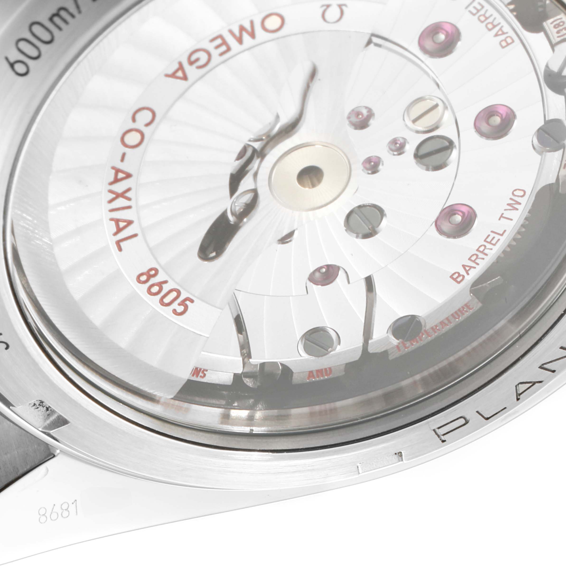 The image shows the back view of the Omega Planet Ocean 232.30.44.22.01.001 Men
s Stainless Steel Black Dial 232.30.44.22.01.001 Men
s Stainless Steel Black Dial watch, highlighting the Co-Axial 8605 movement.