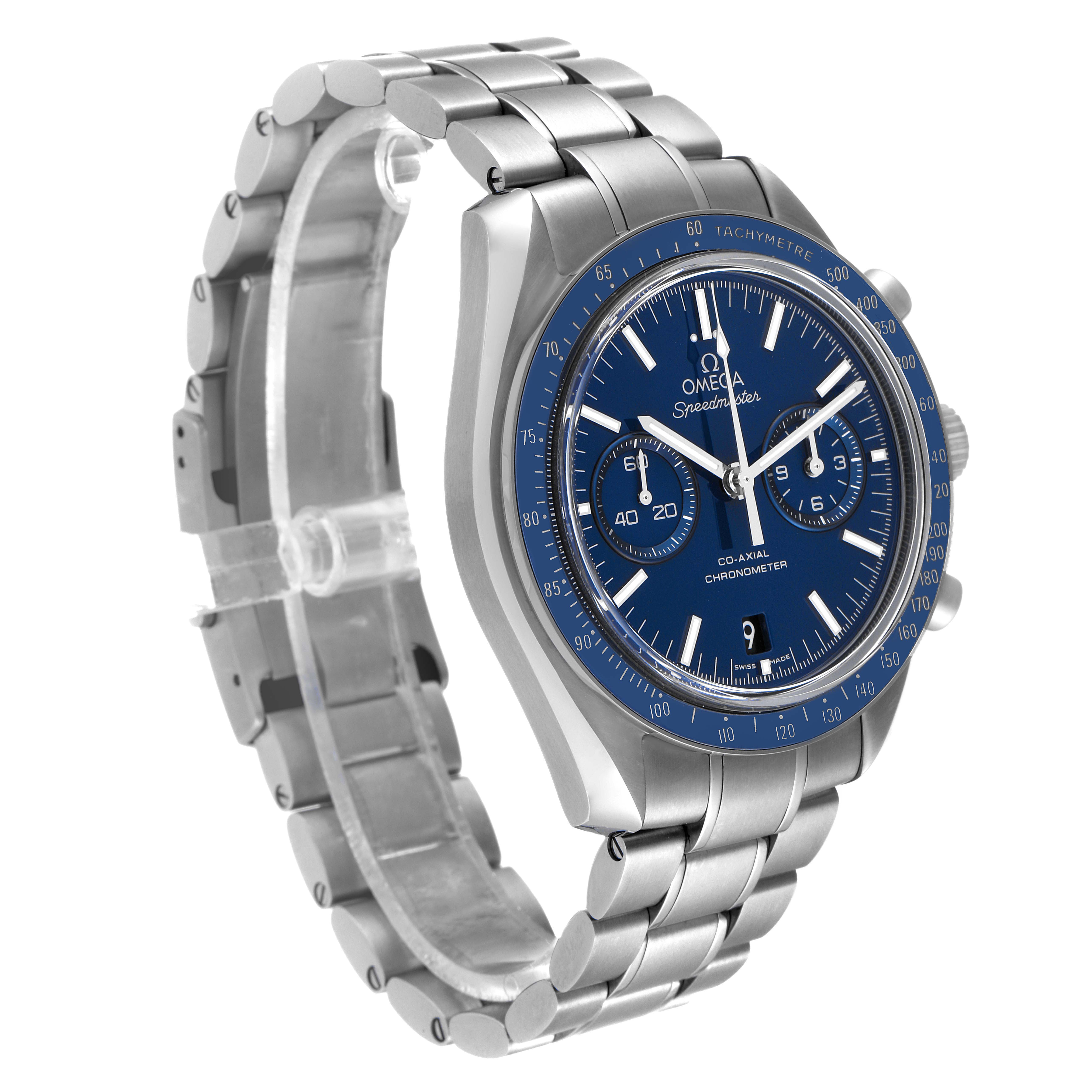 The image shows a side angle of the Omega Speedmaster 311.90.44.51.03.001 Men's Titanium Blue Dial 311.90.44.51.03.001 Men's Titanium Blue Dial watch, highlighting its blue dial, bezel, chronograph sub-dials, and metal bracelet.
