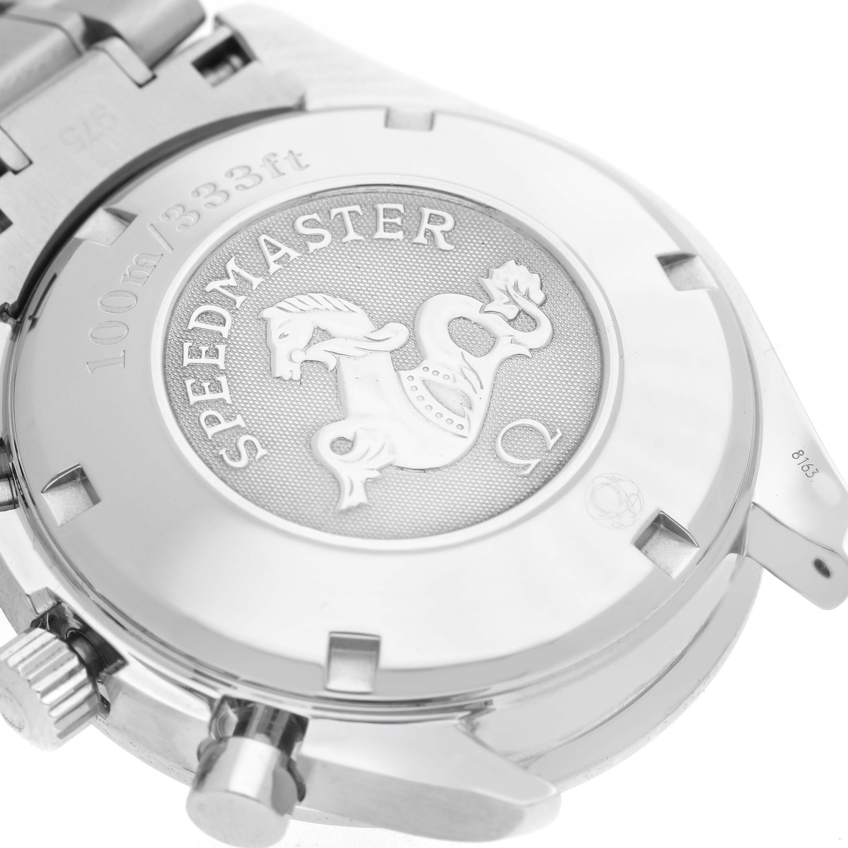 The image shows the case back of an Omega Speedmaster 3221.30.00 Men's Stainless Steel Silver Dial, featuring the emblem and water resistance marking.