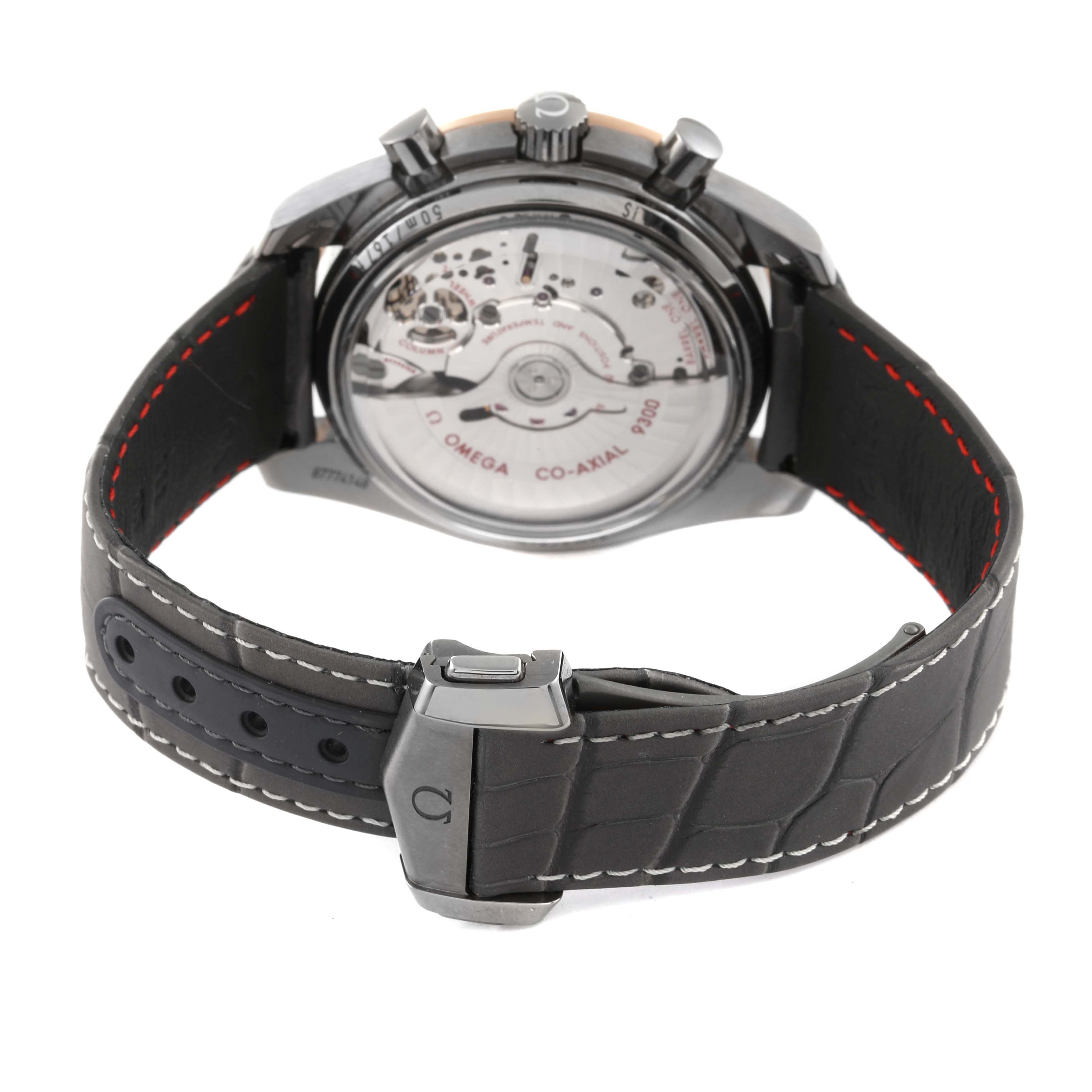 The image shows the back case and leather strap of an Omega Speedmaster 311.63.44.51.99.001 Men's Ceramic Grey Dial 311.63.44.51.99.001 Men's Ceramic Grey Dial watch, highlighting the movement and clasp.