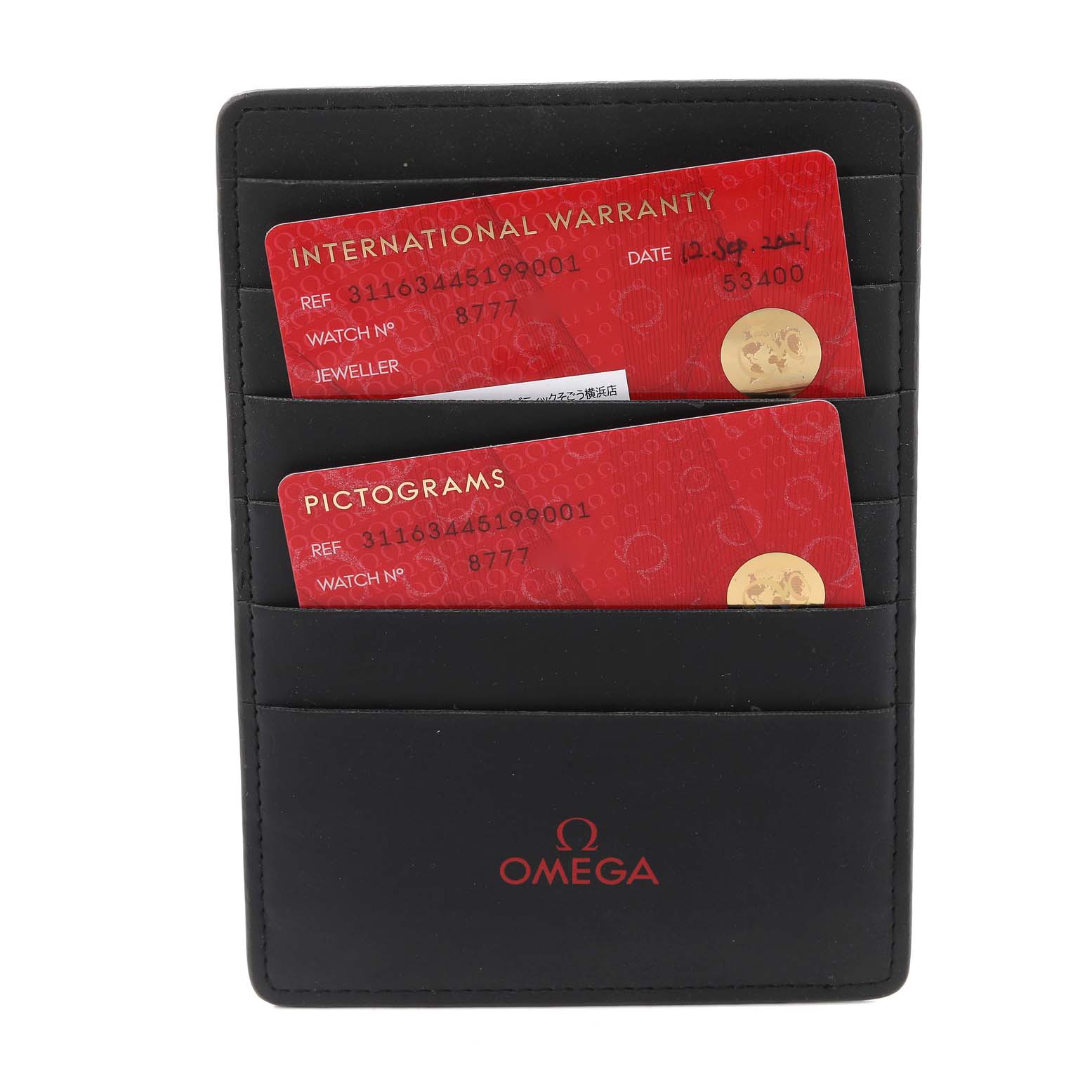 This image shows an Omega Speedmaster 311.63.44.51.99.001 Men's Ceramic Grey Dial 311.63.44.51.99.001 Men's Ceramic Grey Dial accessory with an international warranty card and pictograms card in a black cardholder.