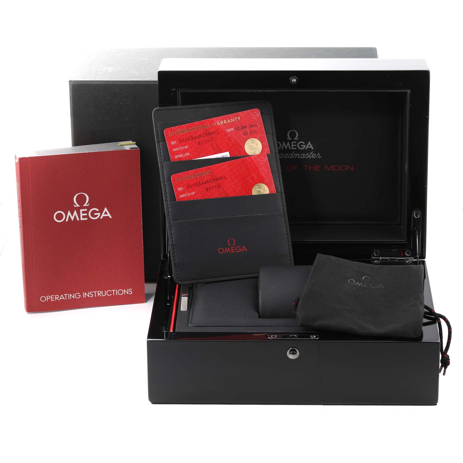 The image shows the packaging, warranty cards, pouch, and operating instructions for the Omega Speedmaster 311.63.44.51.99.001 Men's Ceramic Grey Dial 311.63.44.51.99.001 Men's Ceramic Grey Dial model.