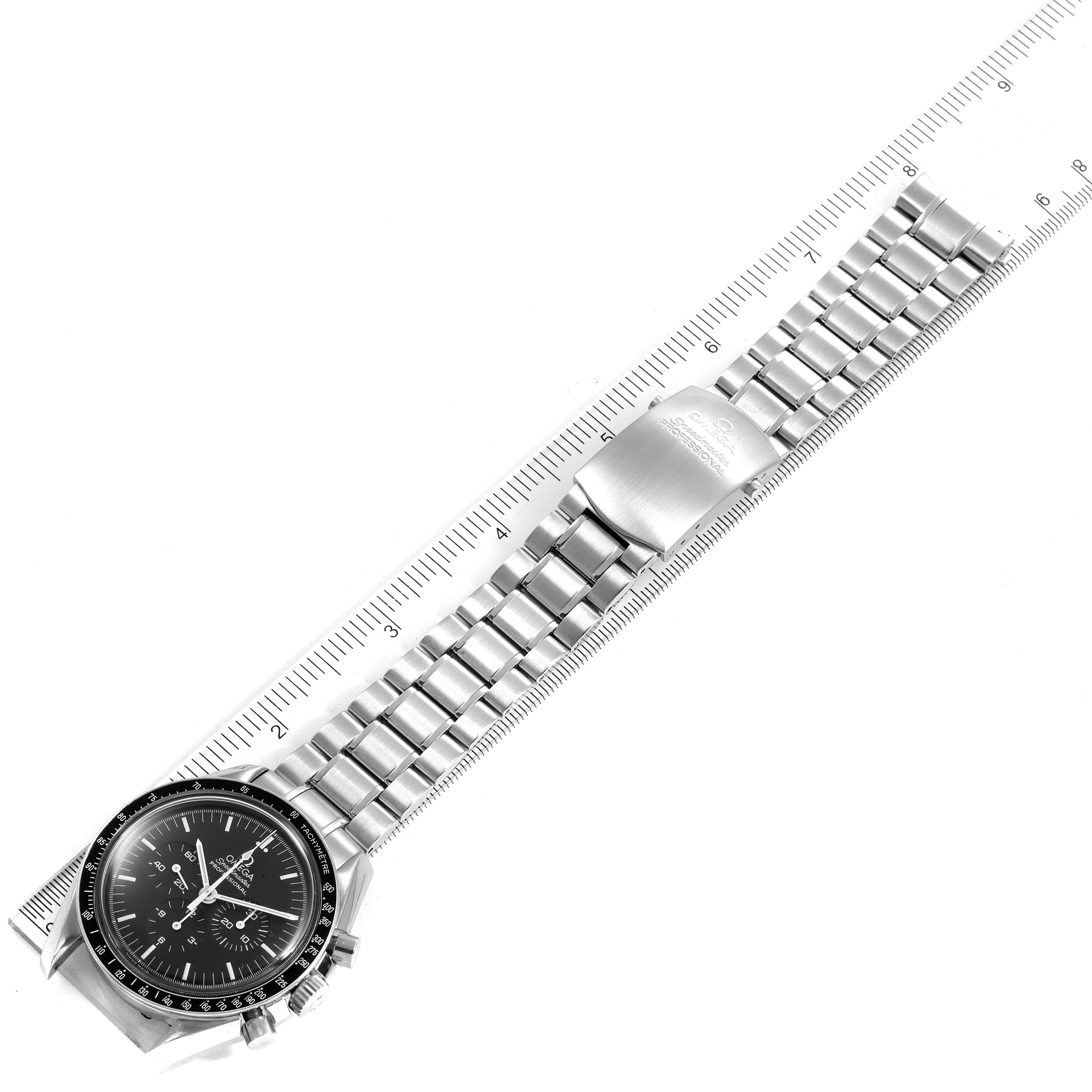 The Omega Speedmaster 3572.50.00 Men
s Stainless Steel Black Dial 3572.50.00 Men
s Stainless Steel Black Dial watch is shown with a side view of the dial and the stainless steel bracelet alongside a ruler.