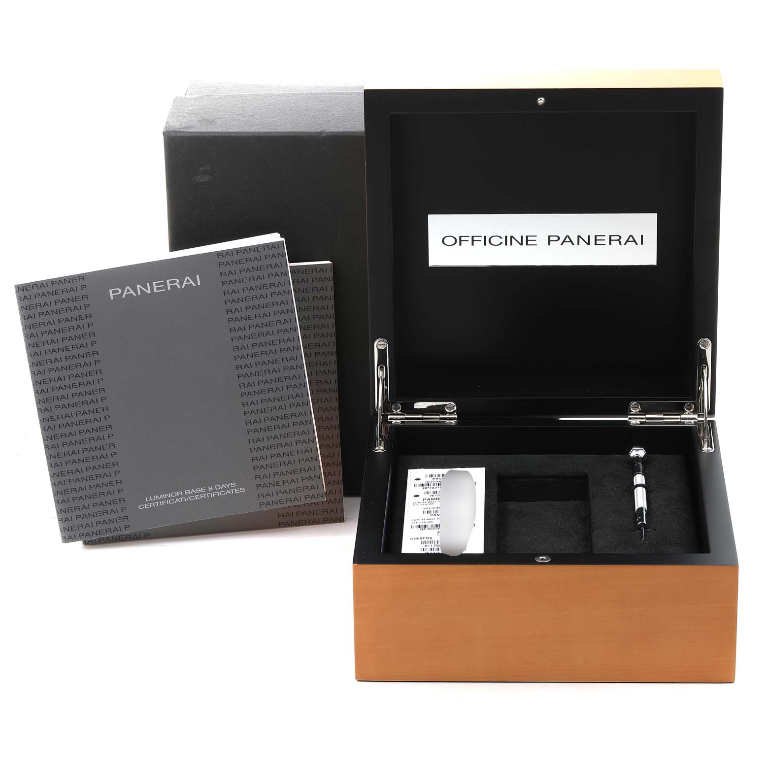 The image shows the open box, manuals, and tools for a Panerai Luminor PAM00561 Men
s Stainless Steel White Dial PAM00561 Men
s Stainless Steel White Dial watch from a top-front angle.