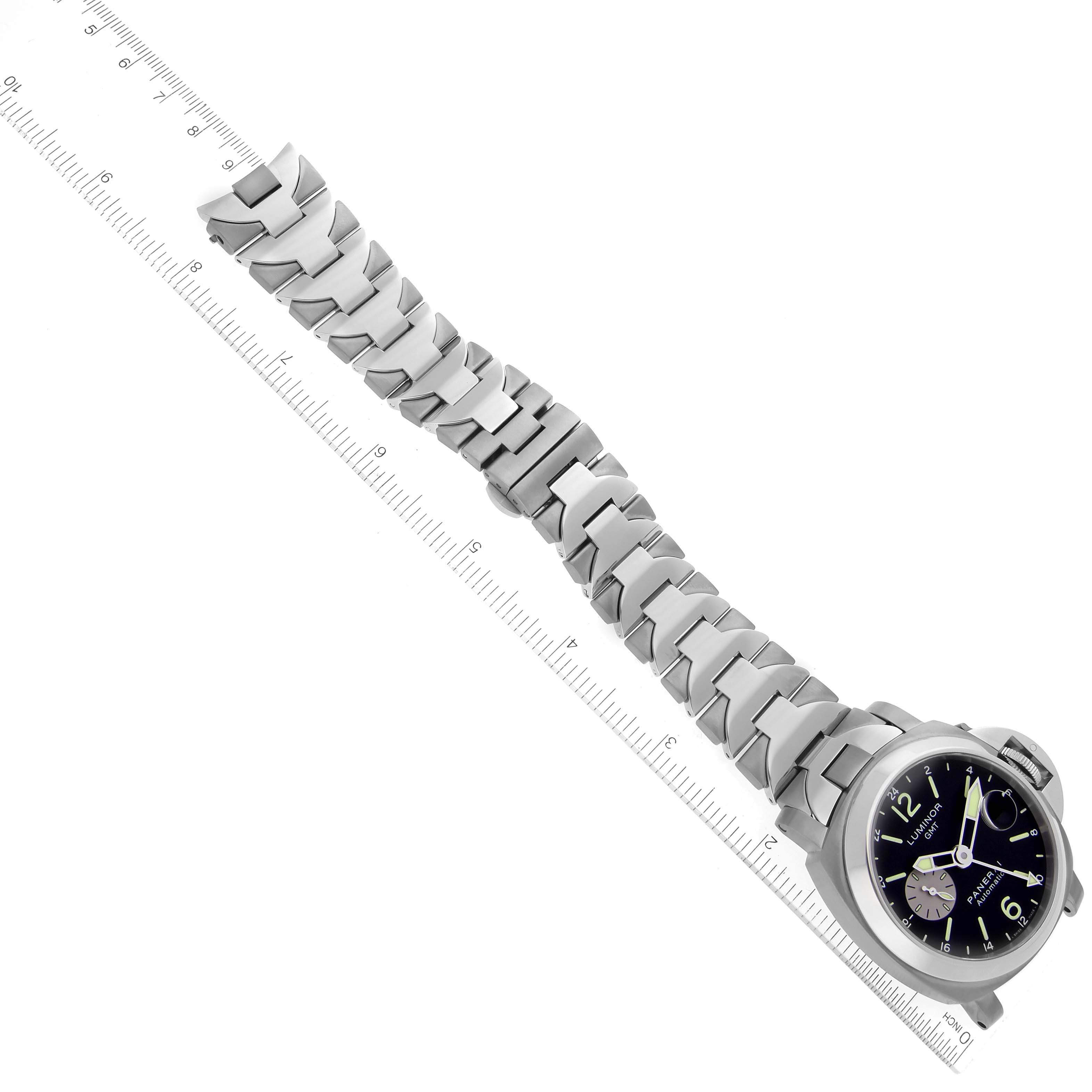 The image shows a Panerai Luminor PAM00161 Men's Titanium Black Dial PAM00161 Men's Titanium Black Dial watch from an overhead angle, focusing on the face and bracelet, measured against a ruler.