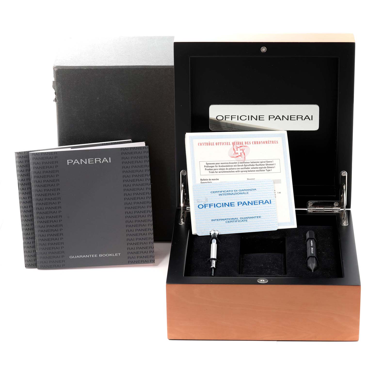 The image shows an open Panerai Luminor PAM00161 Men's Titanium Black Dial PAM00161 Men's Titanium Black Dial watch box with accessories, manuals, and guarantee booklets.