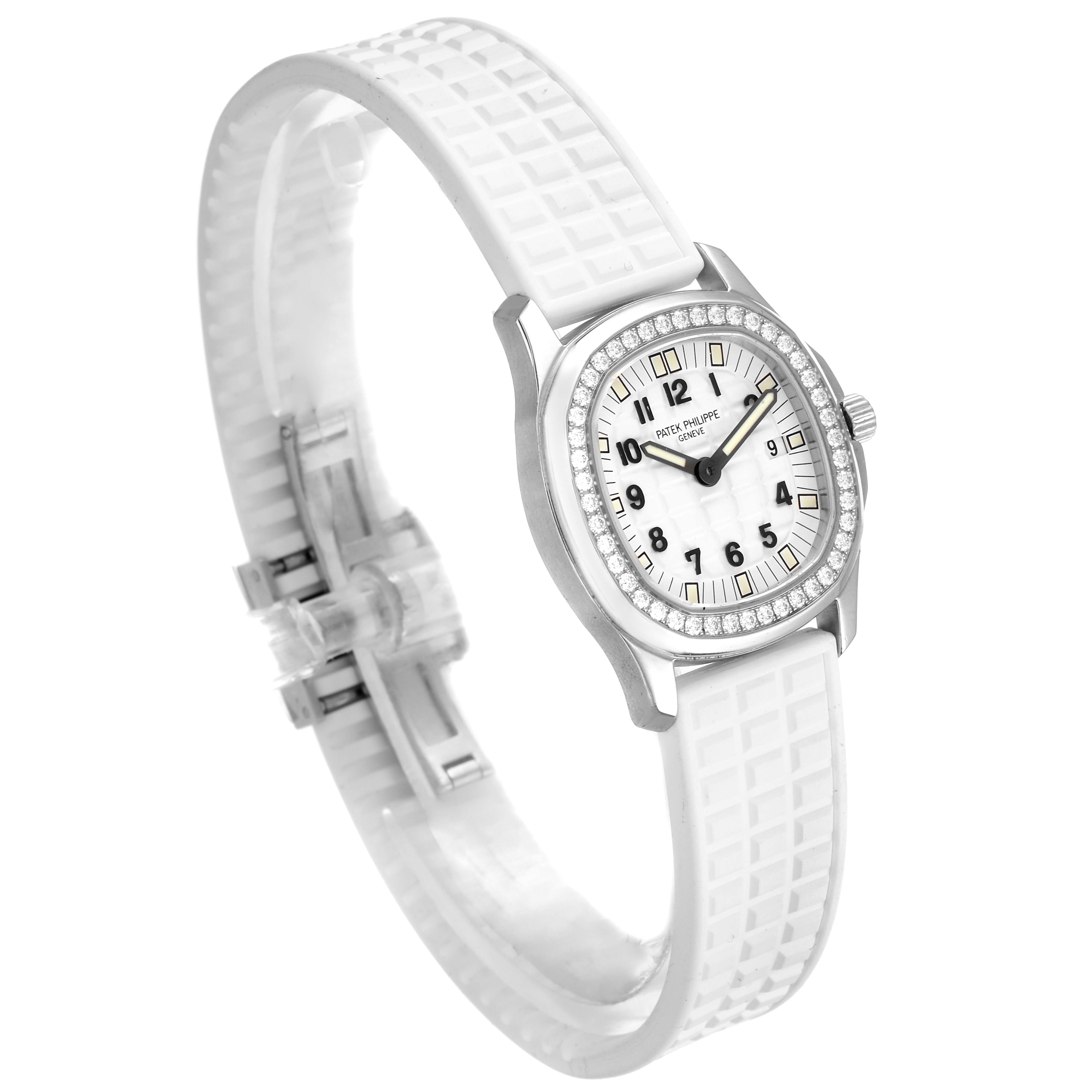 This is a side angle view of the Patek Philippe Aquanaut 4961 Women's Stainless Steel White Dial 4961 Women's Stainless Steel White Dial watch, showing the white strap, diamond bezel, and face.