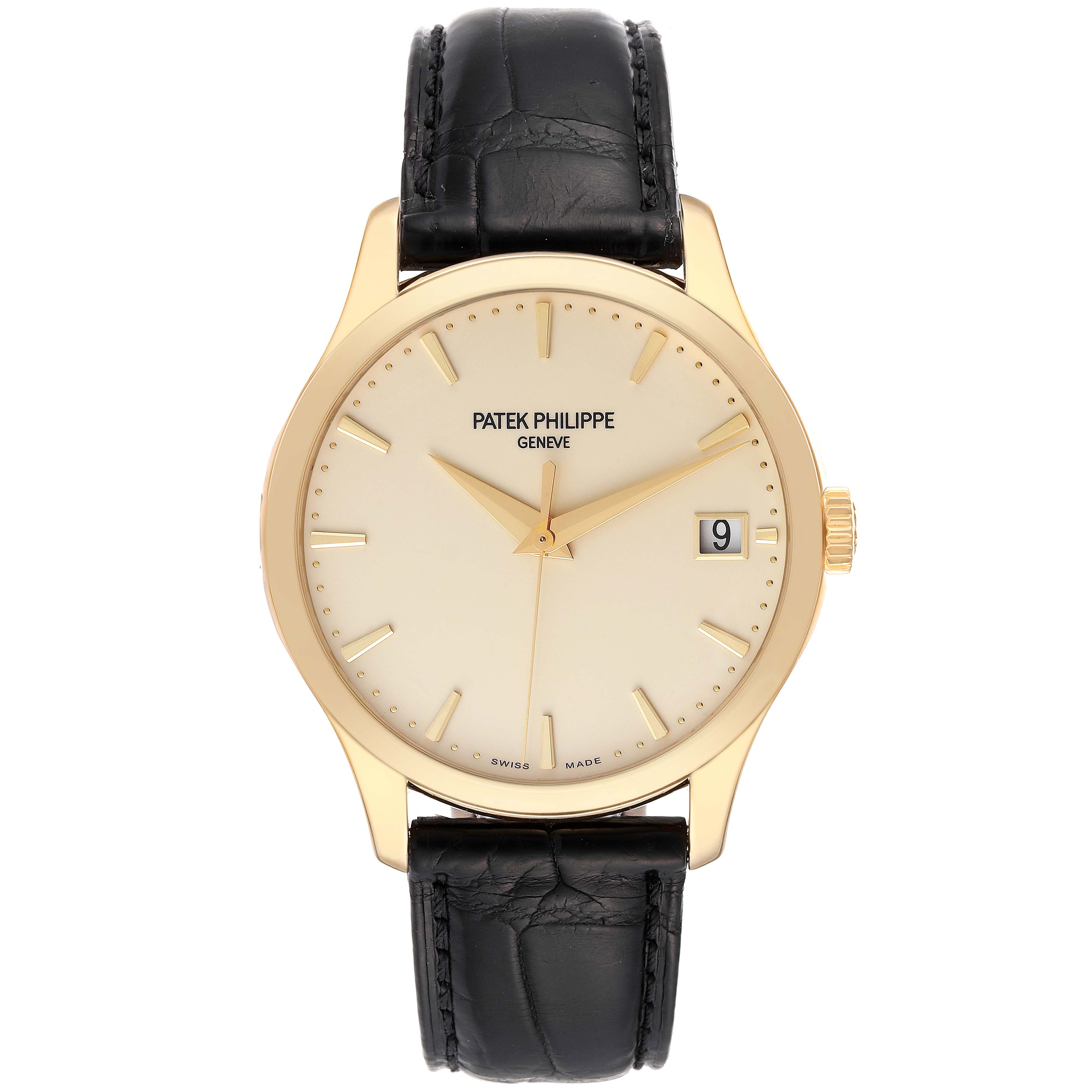 This Patek Philippe Calatrava 5227J-001 Men's Yellow Gold Beige Dial 5227J-001 Men's Yellow Gold Beige Dial model is shown from a front view, displaying the face, hands, date window, and leather strap.