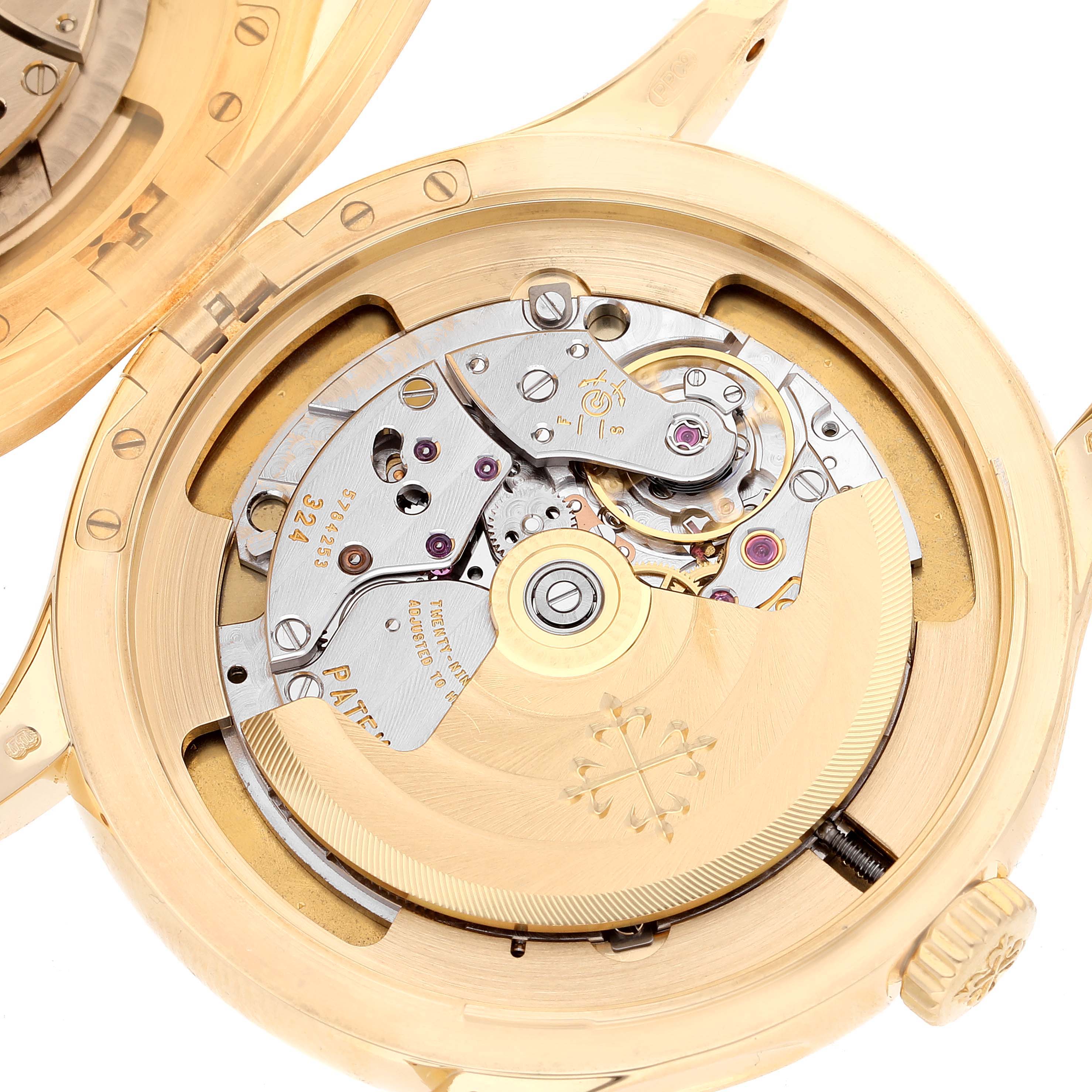 The image shows the open case back of a Patek Philippe Calatrava 5227J-001 Men's Yellow Gold Beige Dial 5227J-001 Men's Yellow Gold Beige Dial, revealing its intricate mechanical movement.