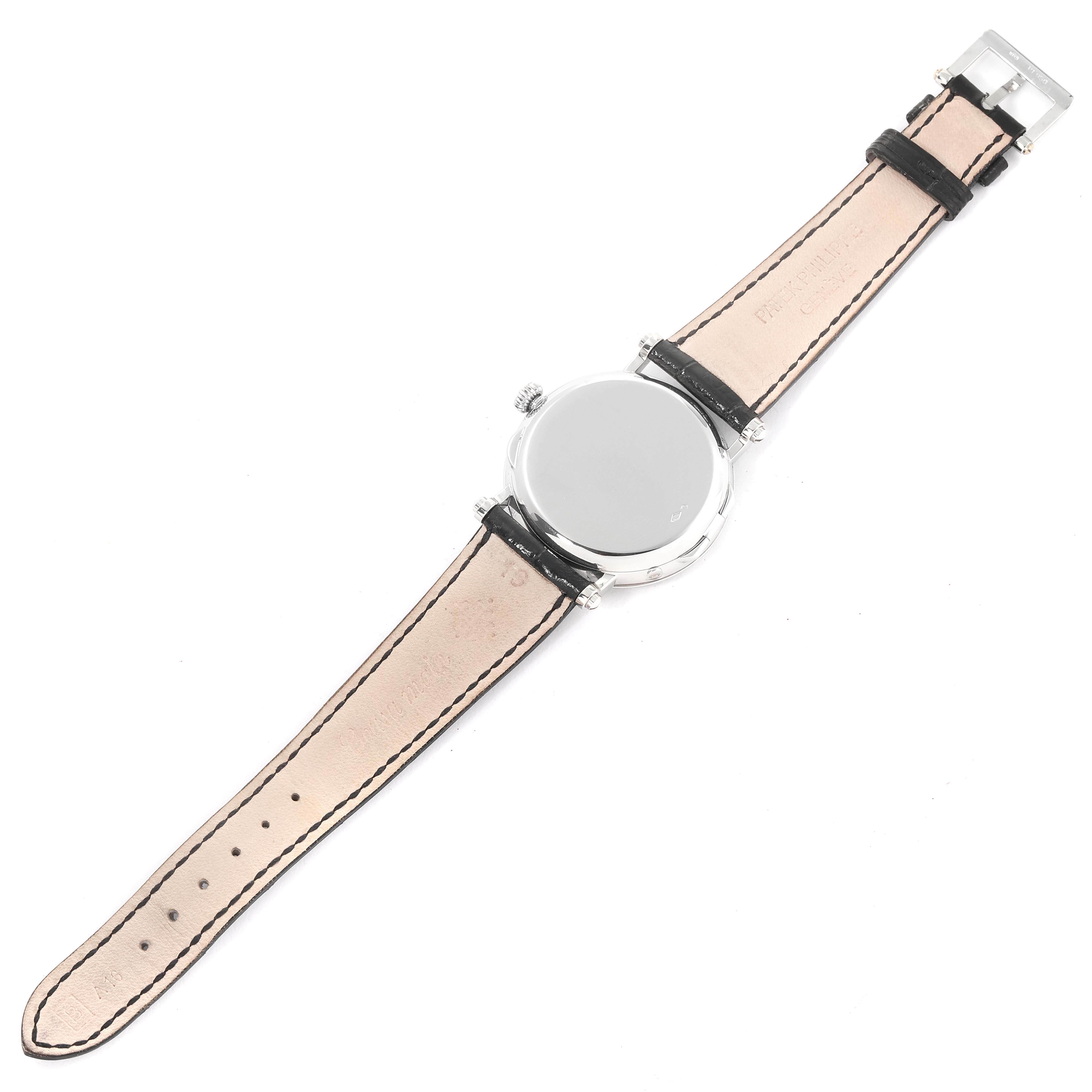 The image shows the back view of a Patek Philippe Complications 5015 Men's Platinum White Dial 5015 Men's Platinum White Dial watch with its leather strap and buckle visible.