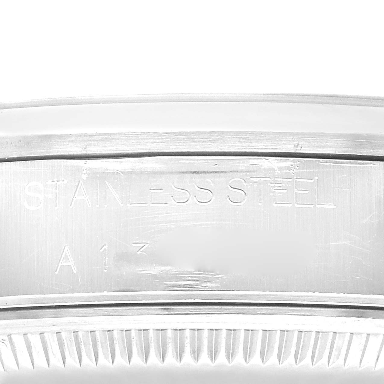 The image shows a close-up of the stainless steel casing with engraving details of a Rolex Date 15200 Men's Stainless Steel Black Dial 15200 Men's Stainless Steel Black Dial model watch.