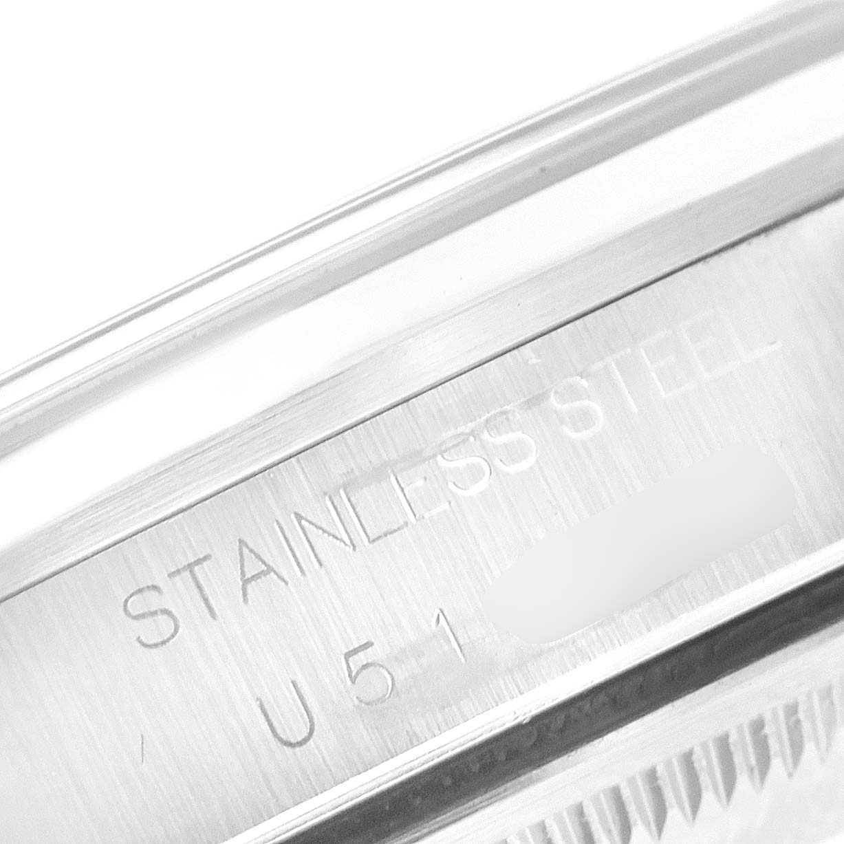 This close-up image of a Rolex Date 15200 Men's Stainless Steel Pink Dial 15200 Men's Stainless Steel Pink Dial model watch shows the stainless steel case with engravings.