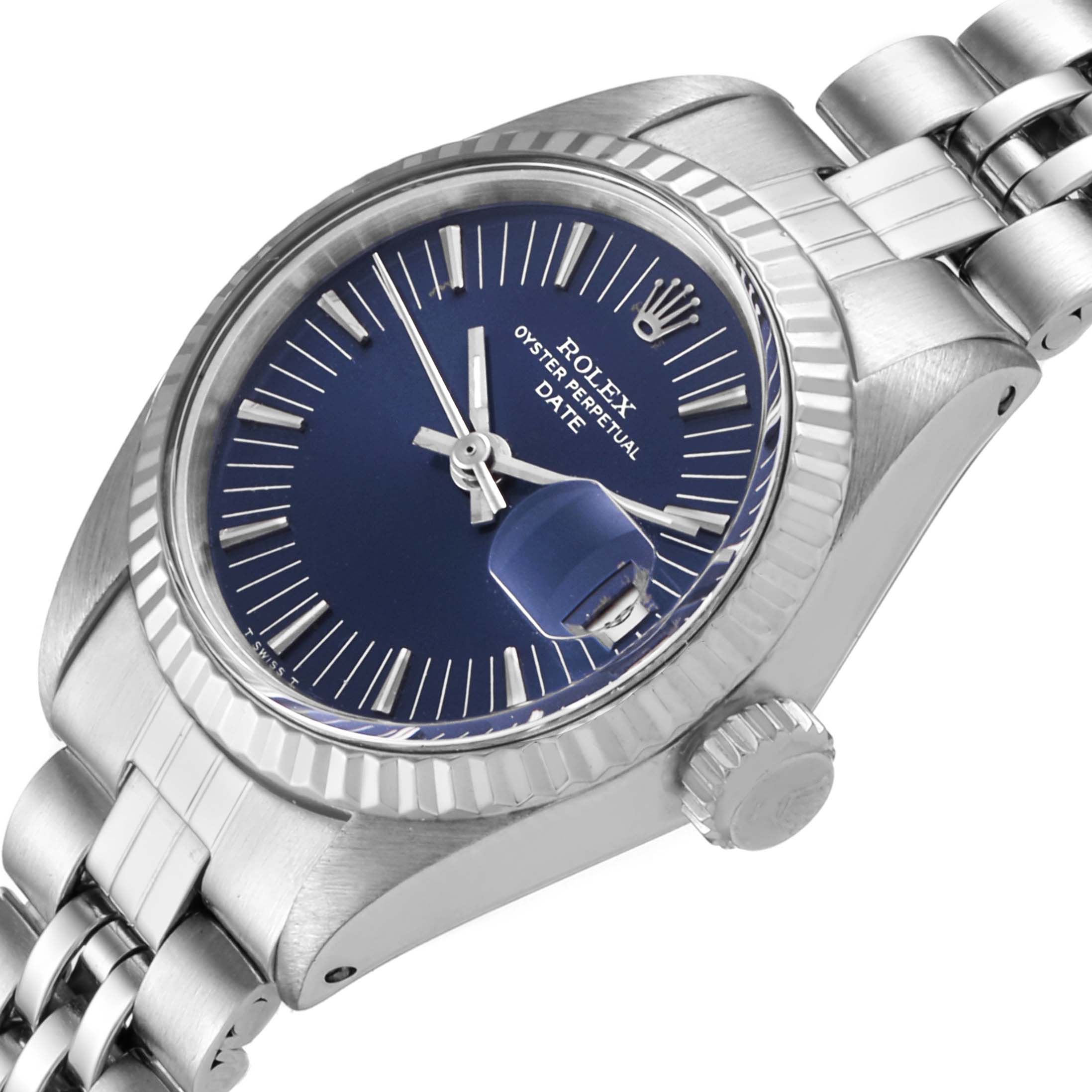 The image shows a close-up side angle of a Rolex Date 6917 Women's Stainless Steel Blue Dial 6917 Women's Stainless Steel Blue Dial model watch, highlighting the dial, crown, and bracelet.