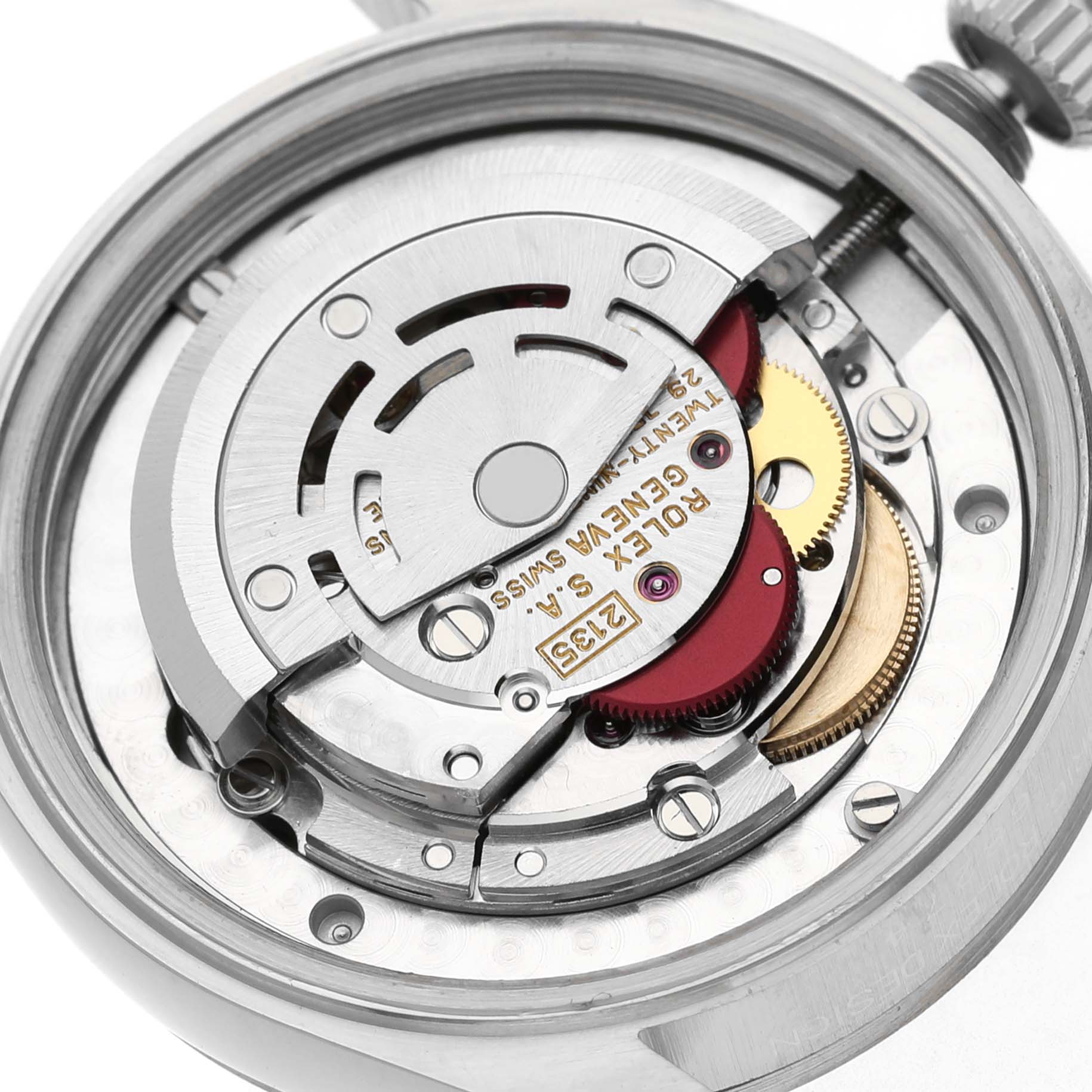The image shows the internal mechanism of a Rolex Mid-Size 68274 Women's Stainless Steel Black Dial watch from a close-up, top-down angle displaying the rotor and gears.