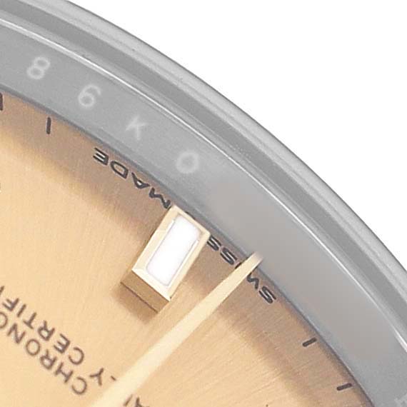 The image shows a close-up of the dial and hour marker of a Rolex Datejust 278273 Men's Steel and Gold (two tone) Champagne Dial watch at an angle.