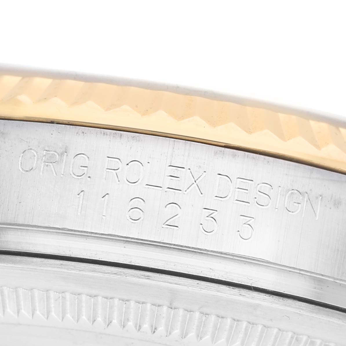 The image shows a close-up of the side of a Rolex Datejust 116233 Men's Stainless Steel Champagne Dial watch, featuring the model number engraving on the case.
