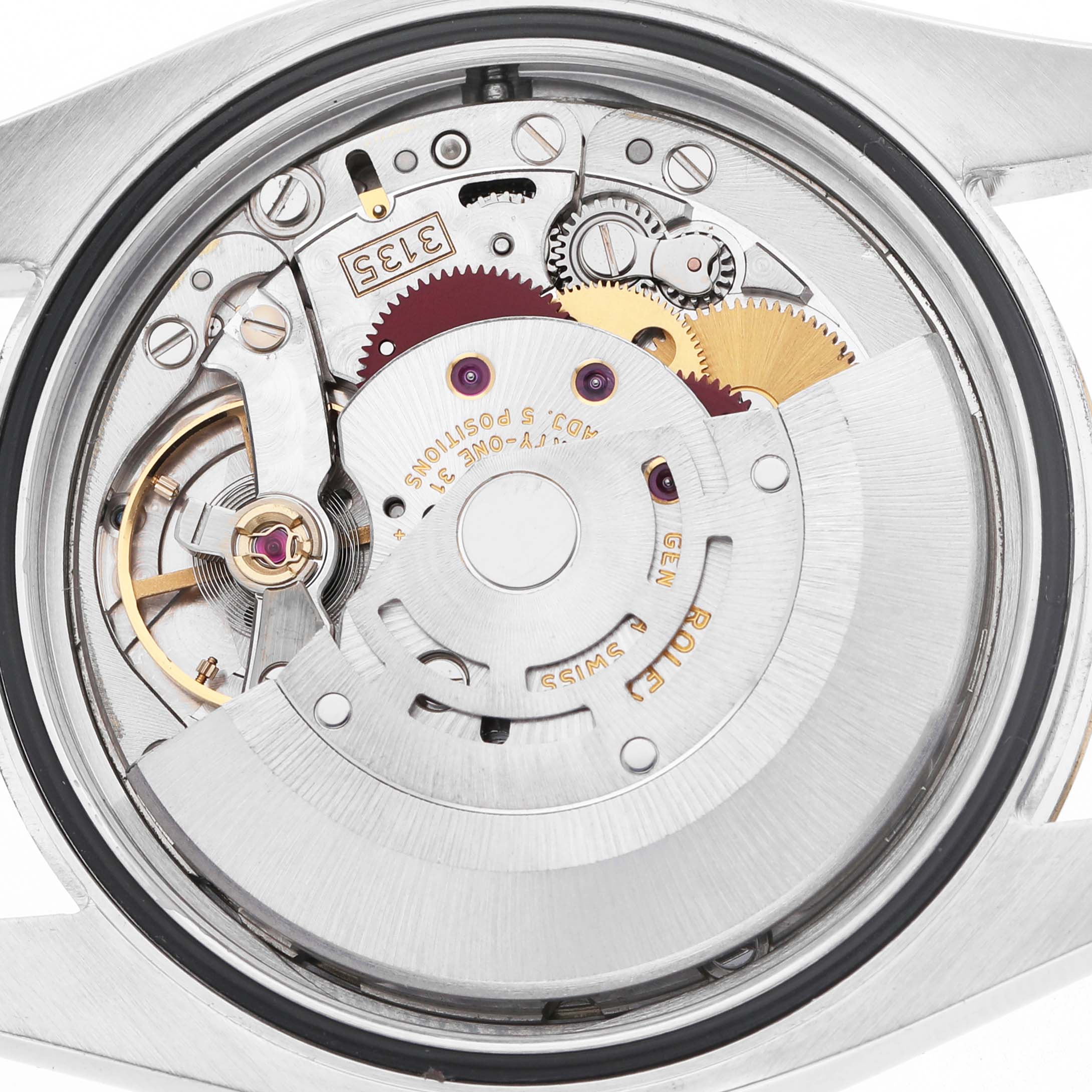 The image shows the movement of a Rolex Datejust 116233 Men's Stainless Steel Champagne Dial watch from the back, illustrating gears and mechanical components.