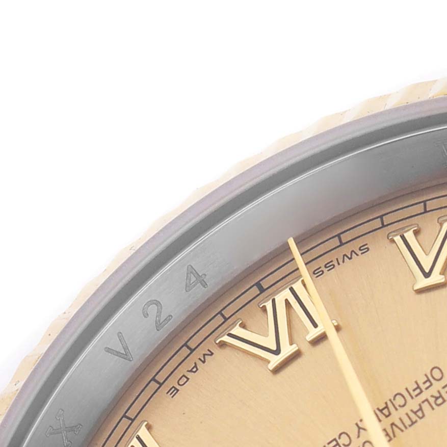 The image shows a close-up of the Rolex Datejust 116233 Men's Stainless Steel Champagne Dial, focusing on the dial, Roman numerals, and a portion of the bezel.